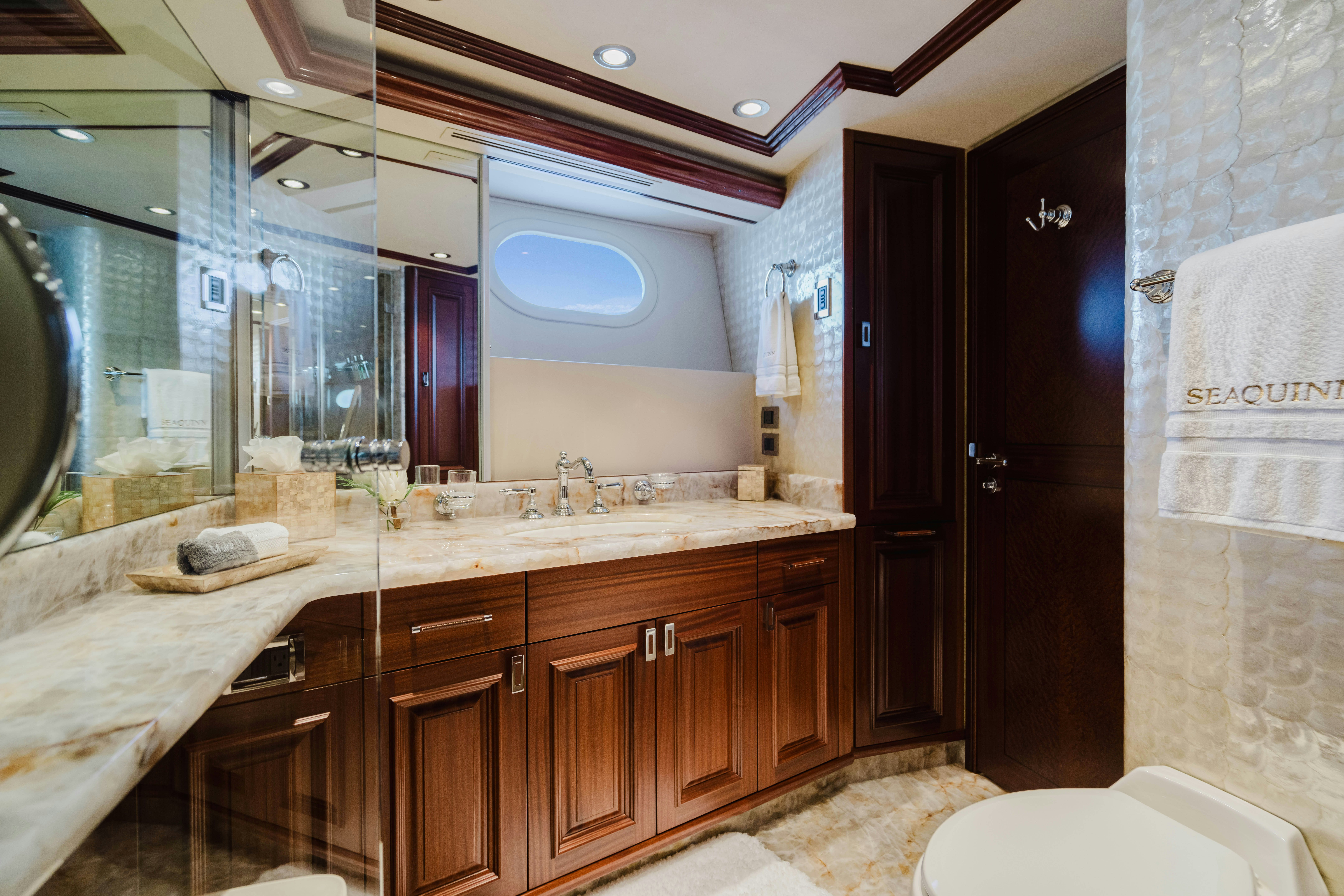 a bathroom with a large mirror aboard SEAQUINN Yacht for Sale