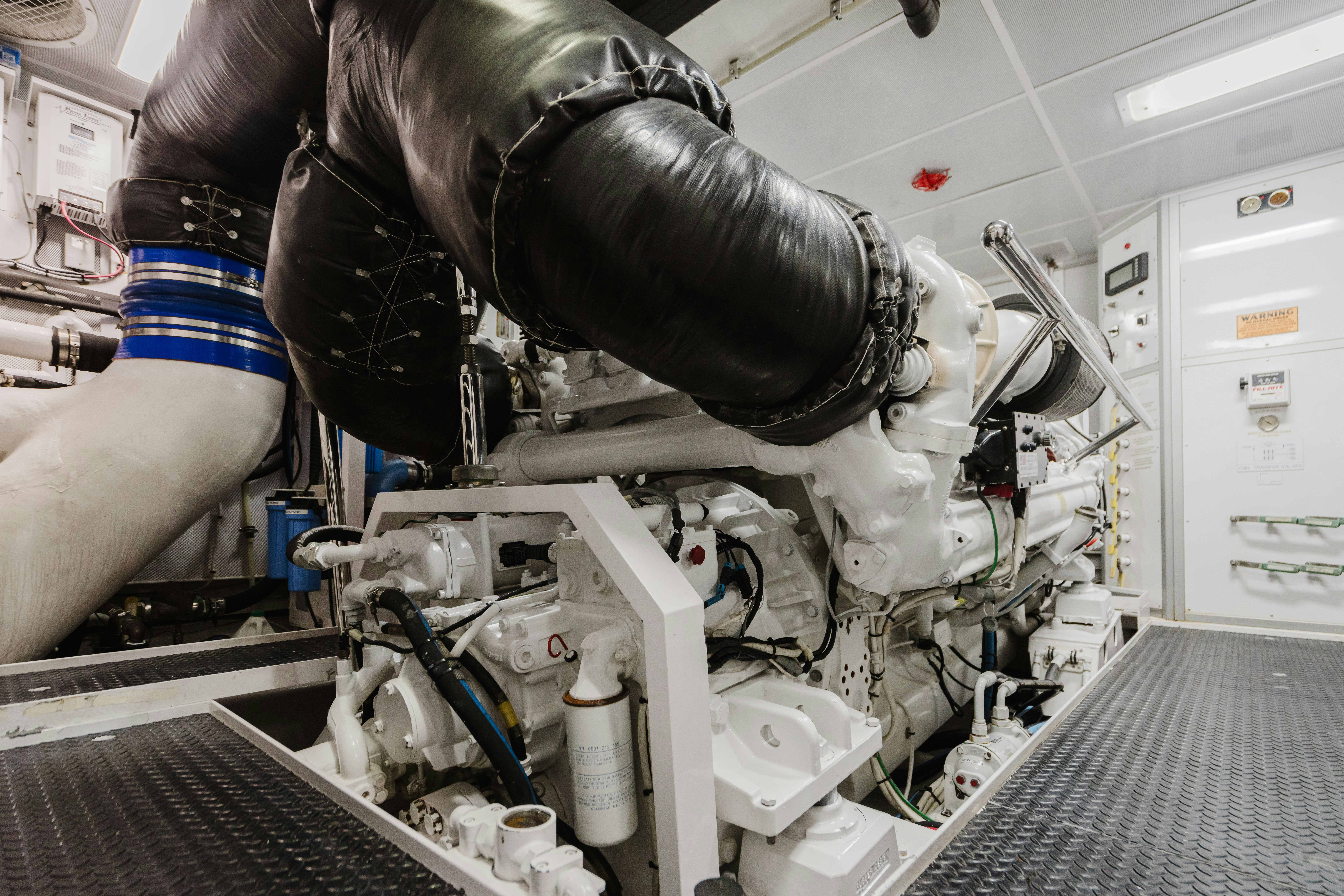 a person working on a machine aboard SEAQUINN Yacht for Sale