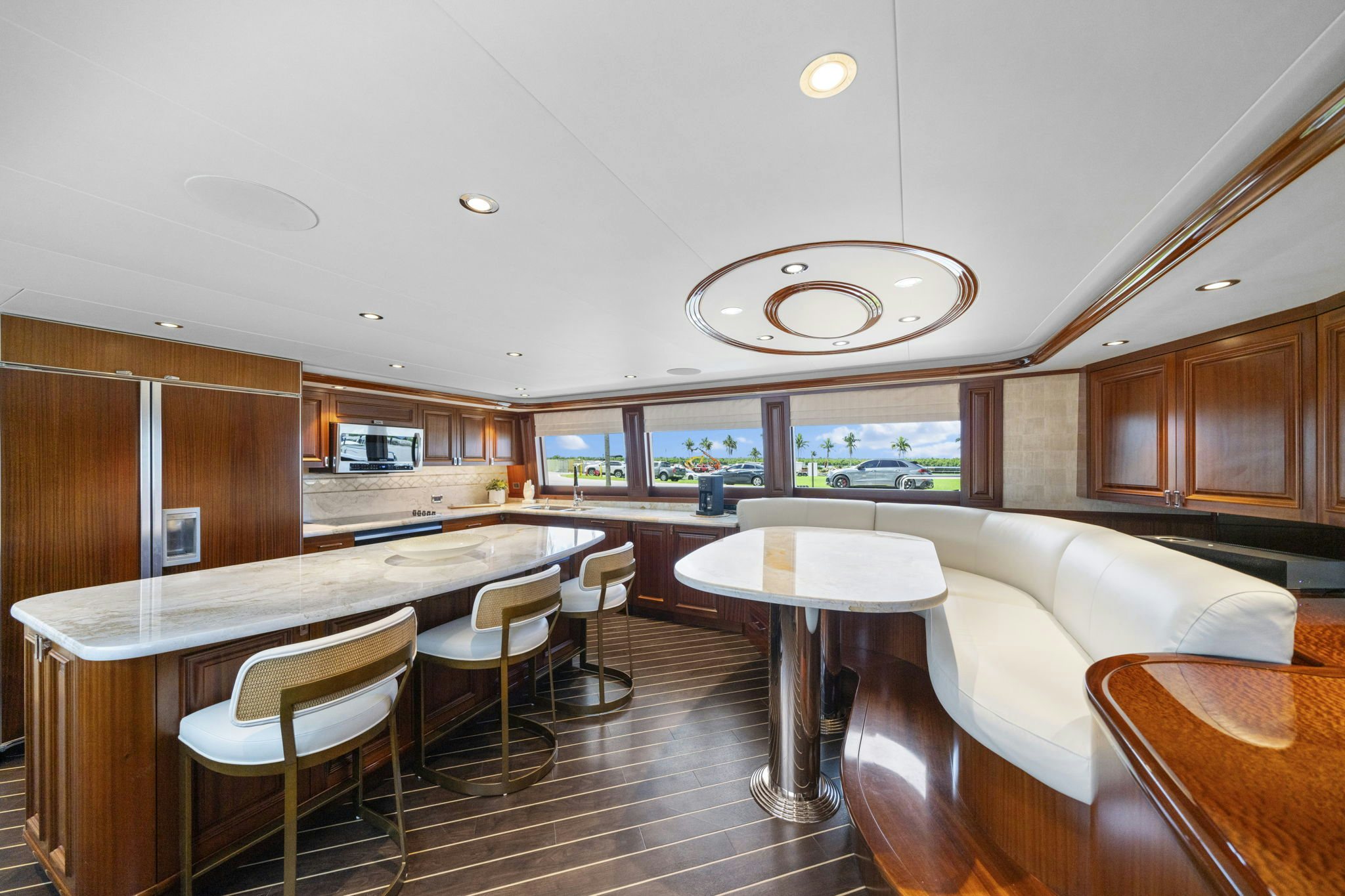 a large kitchen with a dining table aboard SEAQUINN Yacht for Sale