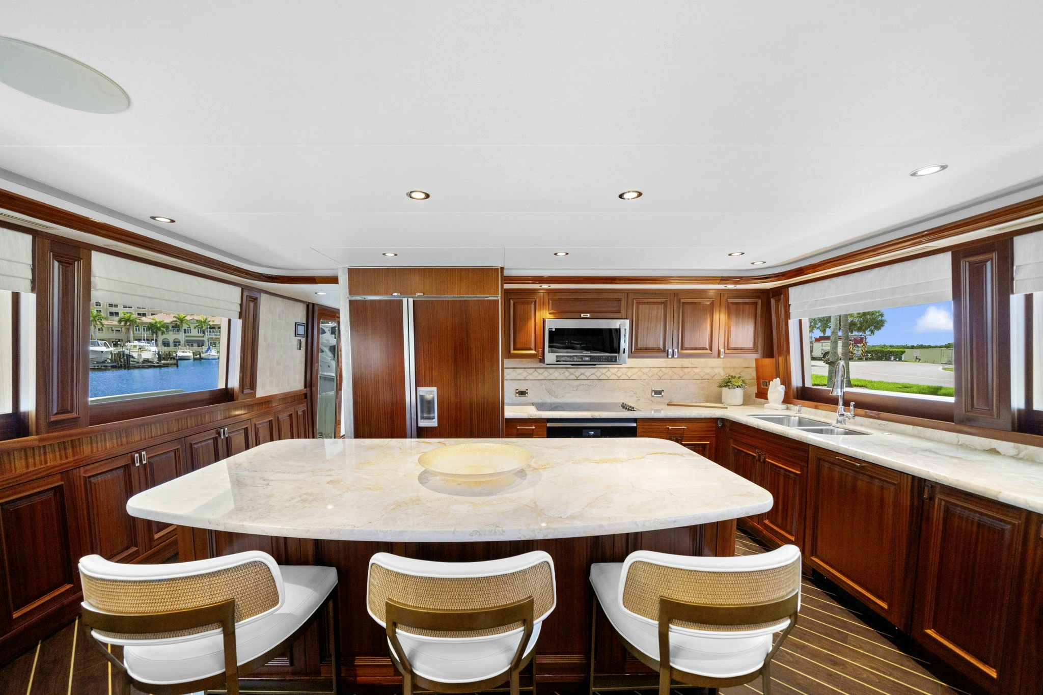 a kitchen with a table and chairs aboard SEAQUINN Yacht for Sale
