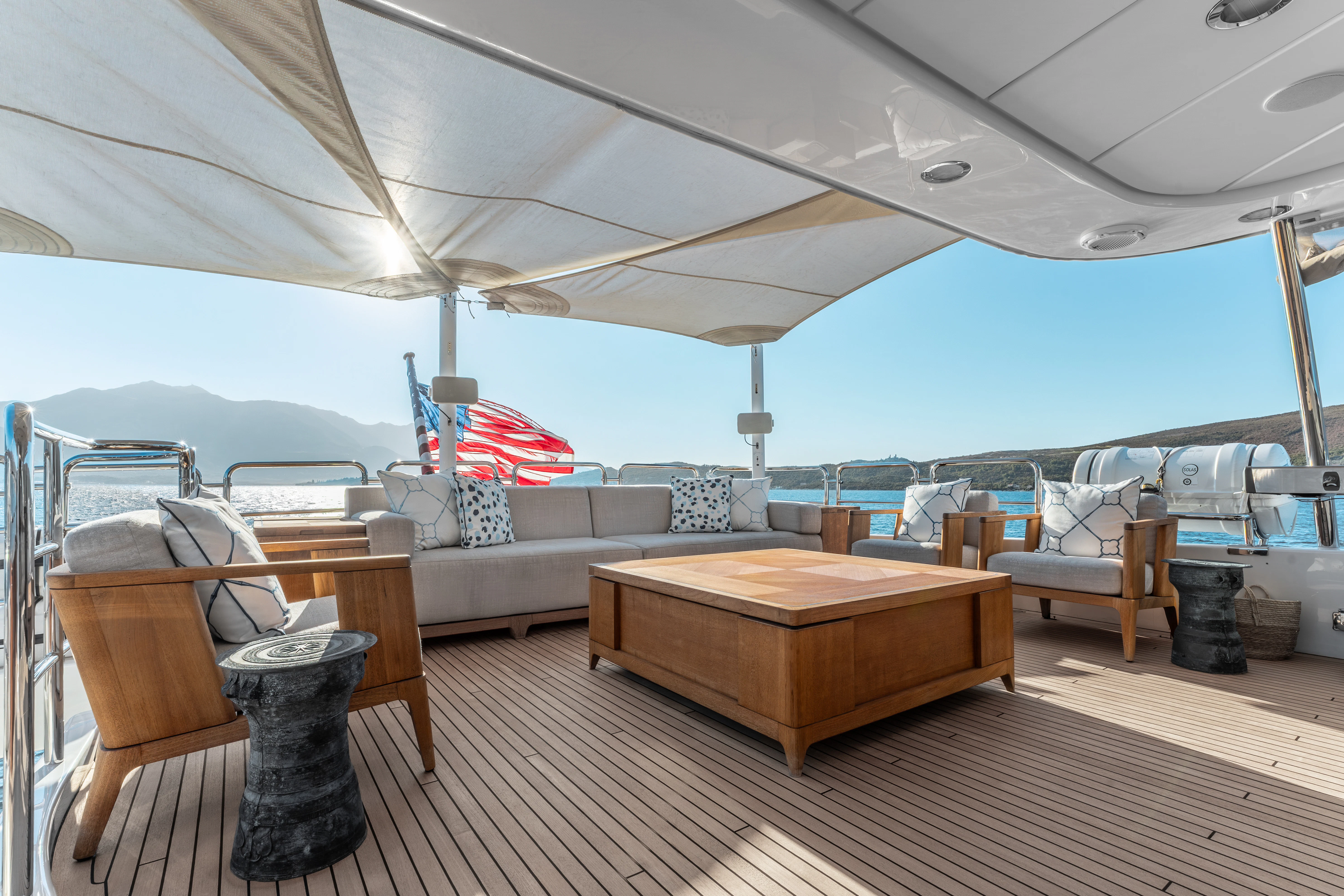 a large living room with a large bed and a large blue tent aboard ARTEMIS Yacht for Sale