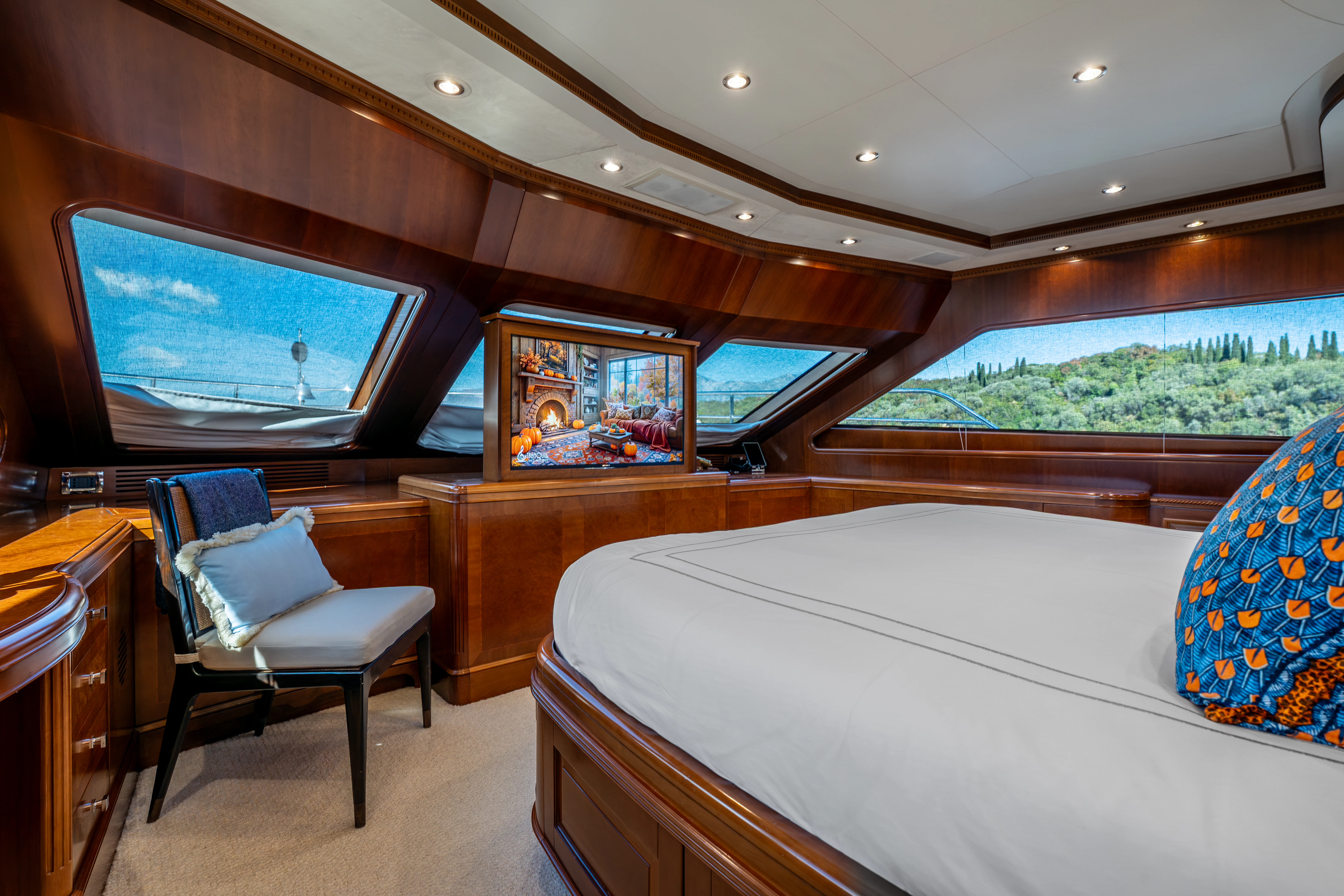 a room with a bed and a tv aboard ARTEMIS Yacht for Sale