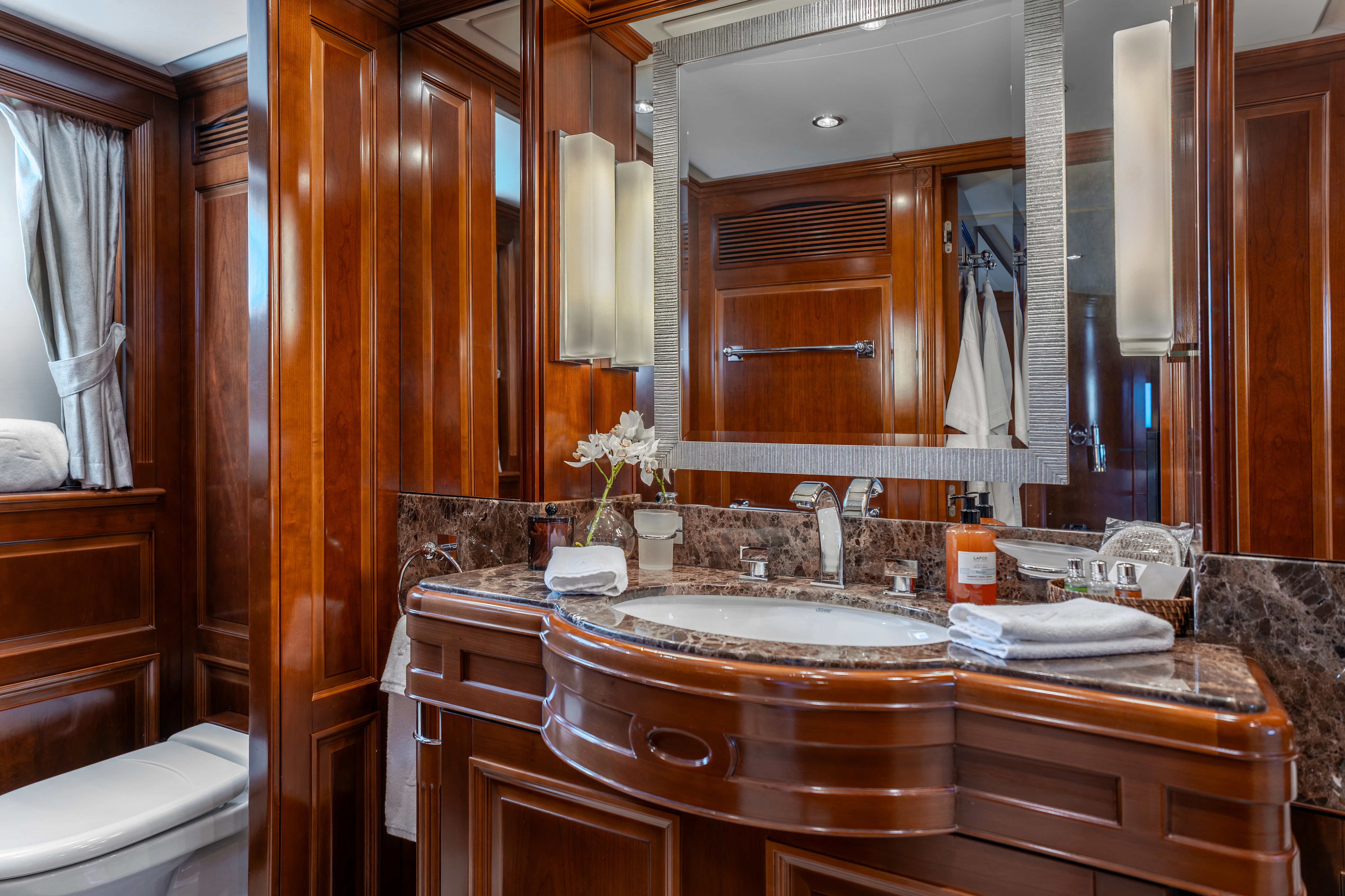 a bathroom with a sink and mirror aboard ARTEMIS Yacht for Sale