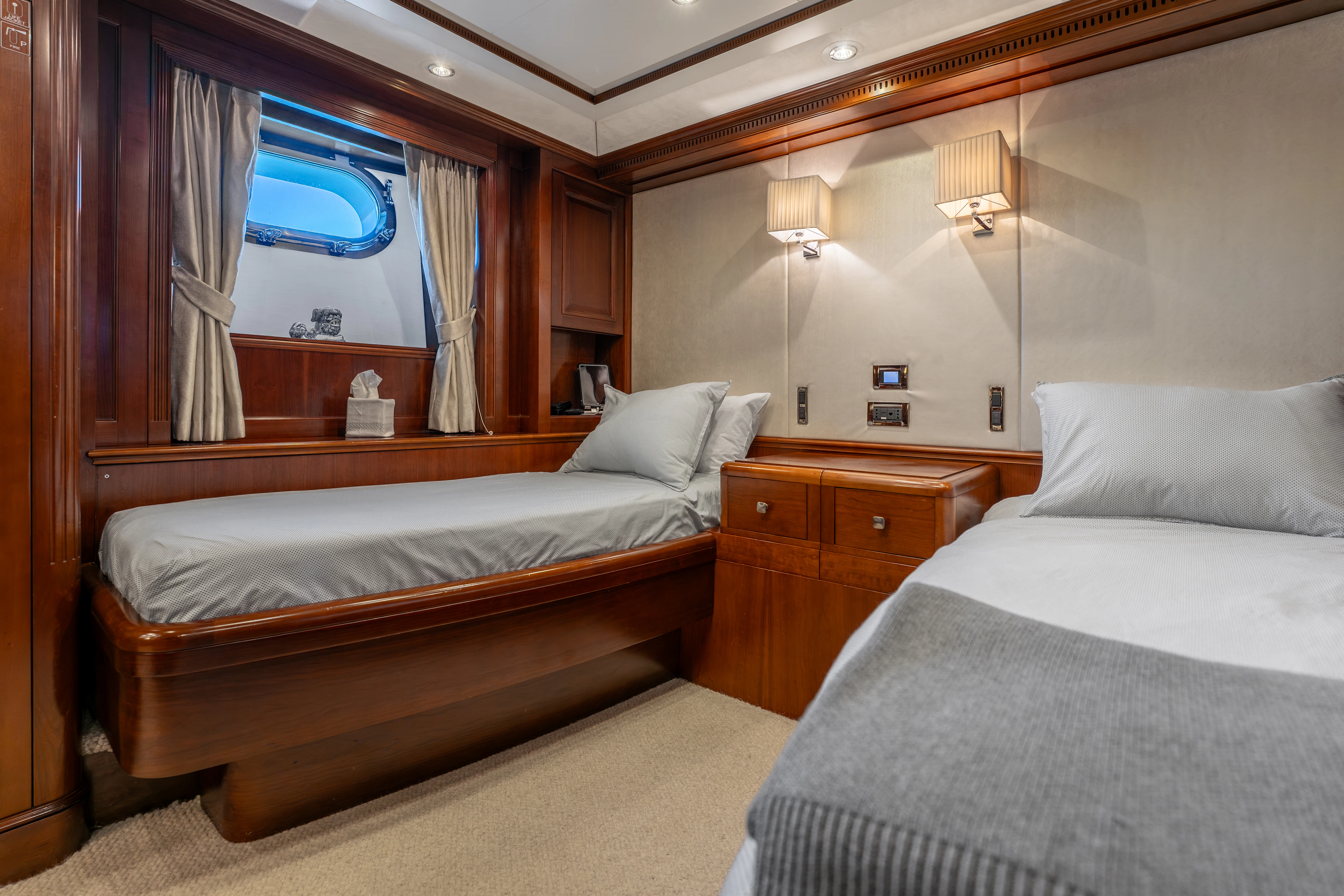 a room with two beds aboard ARTEMIS Yacht for Sale