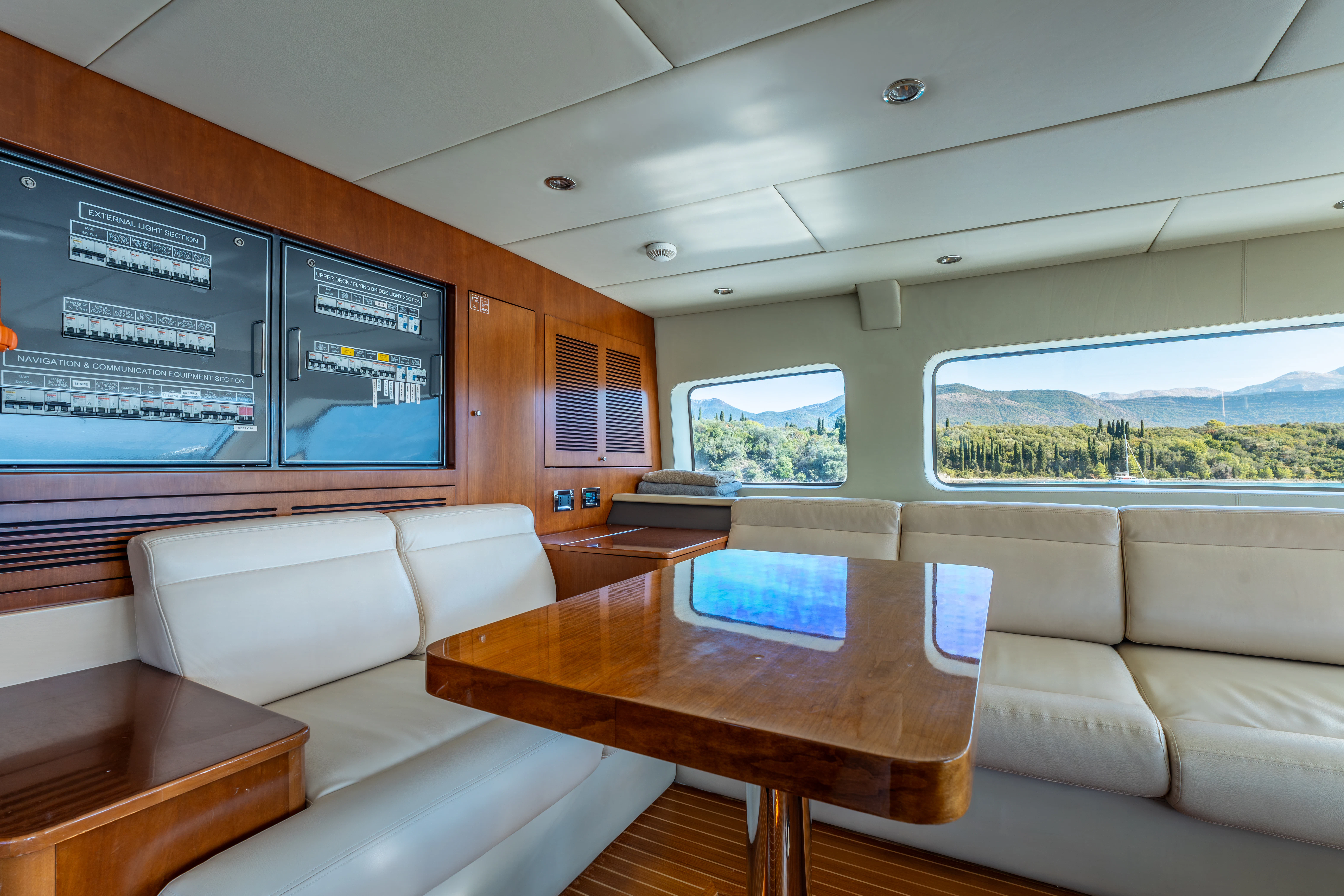 a room with couches and a table aboard ARTEMIS Yacht for Sale