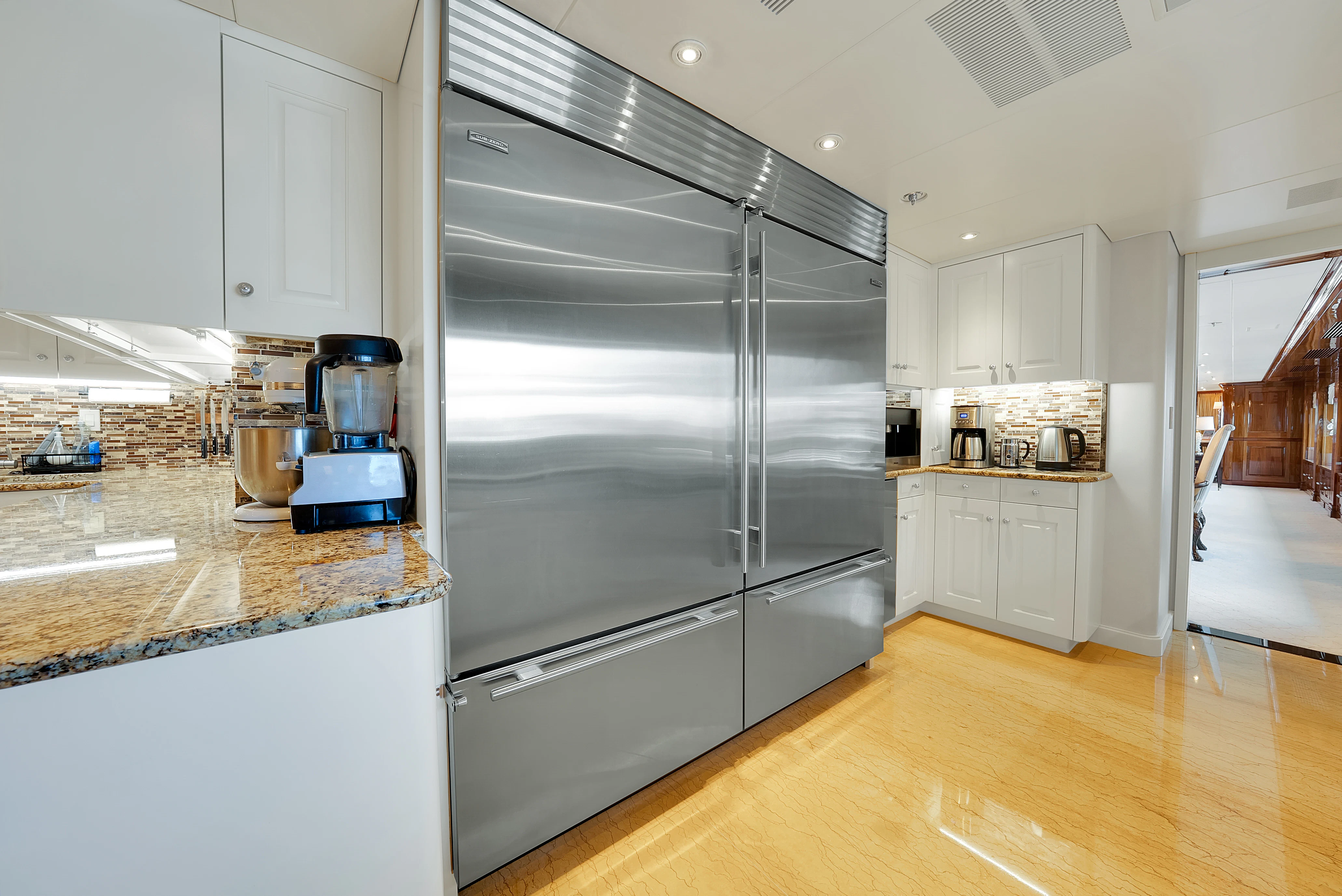 a kitchen with stainless steel appliances aboard SILVER LINING Yacht for Sale