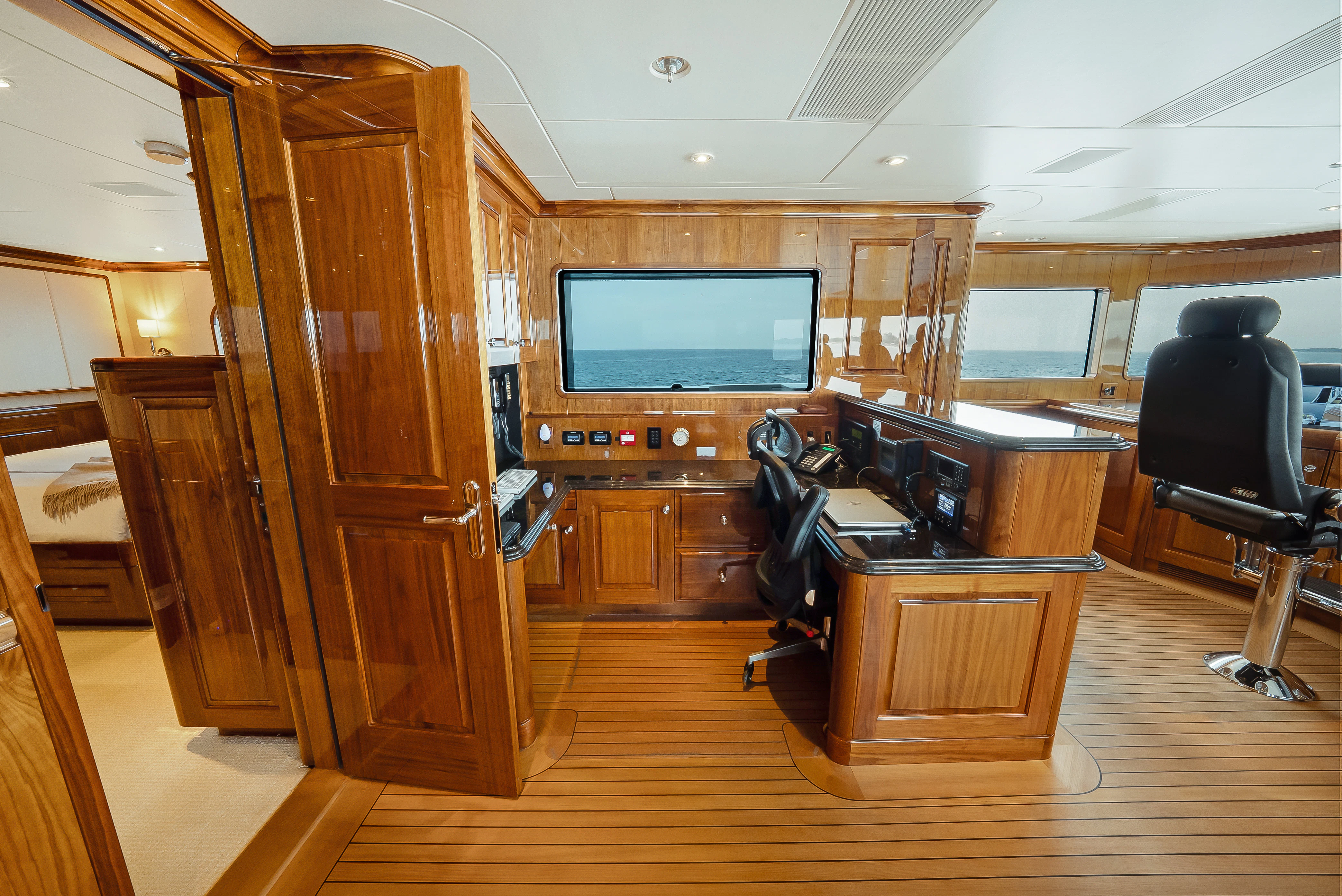 a room with a tv and a desk aboard SILVER LINING Yacht for Sale