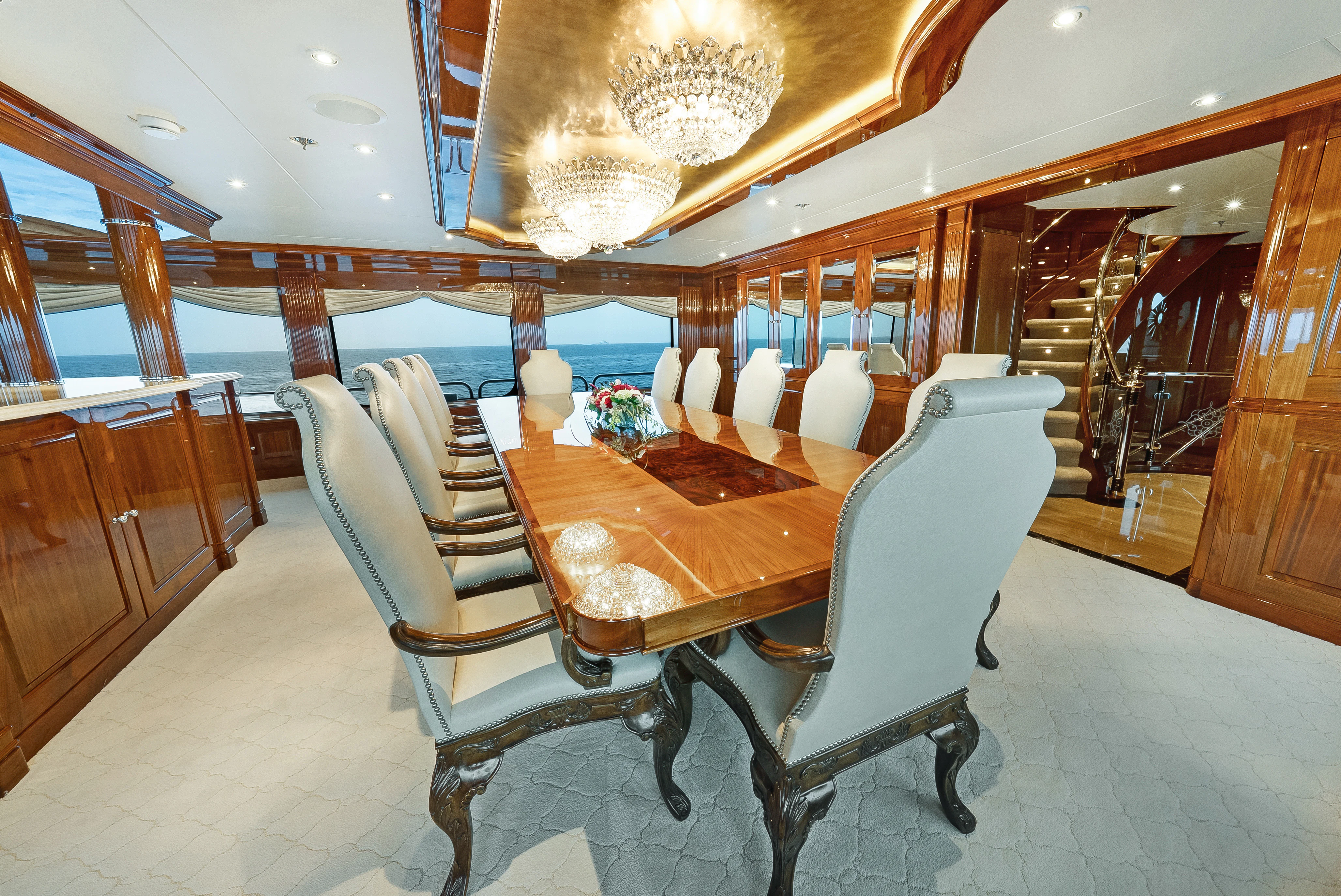 a room with a table chairs and a large window aboard SILVER LINING Yacht for Sale