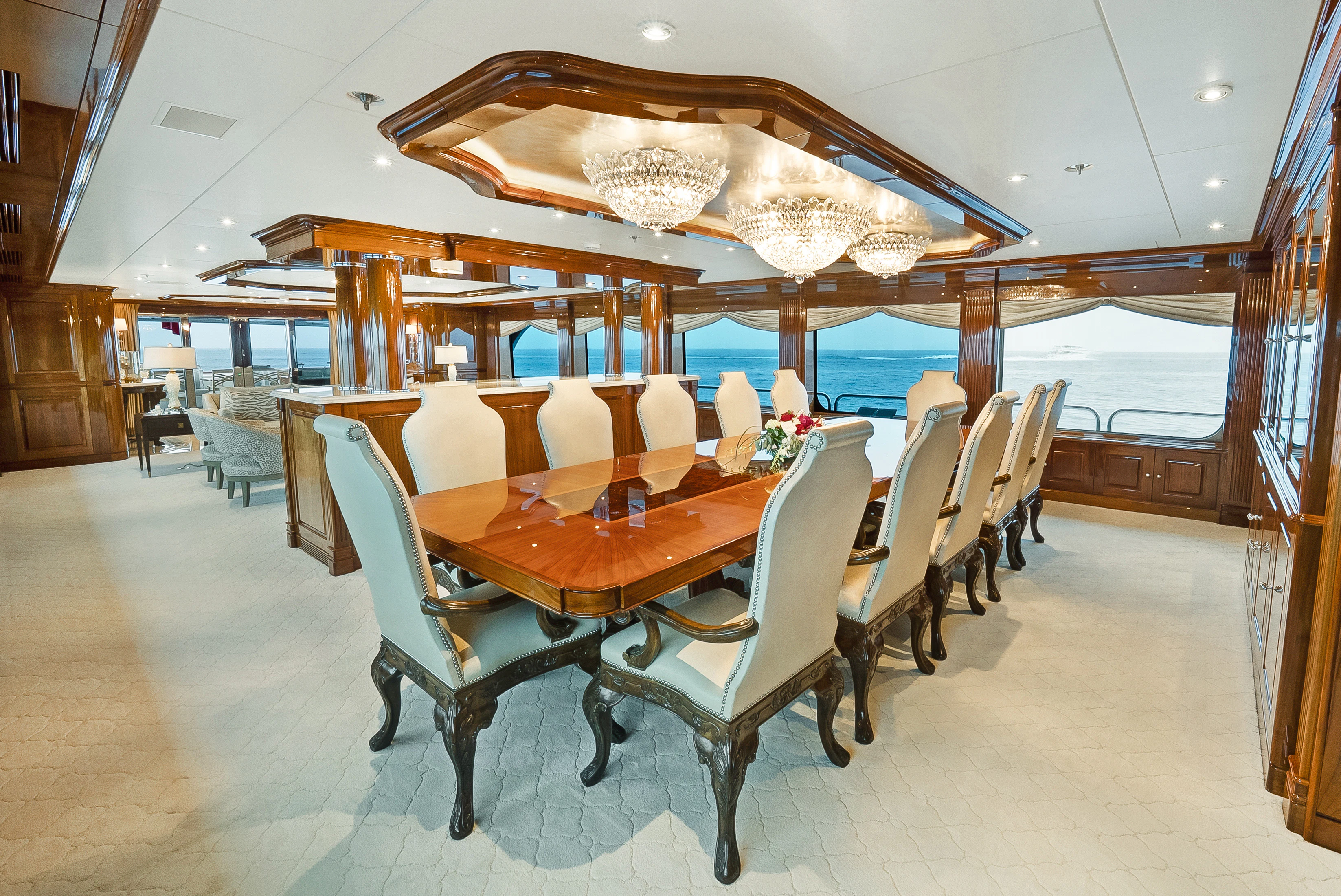 a dining room with a table and chairs aboard SILVER LINING Yacht for Sale