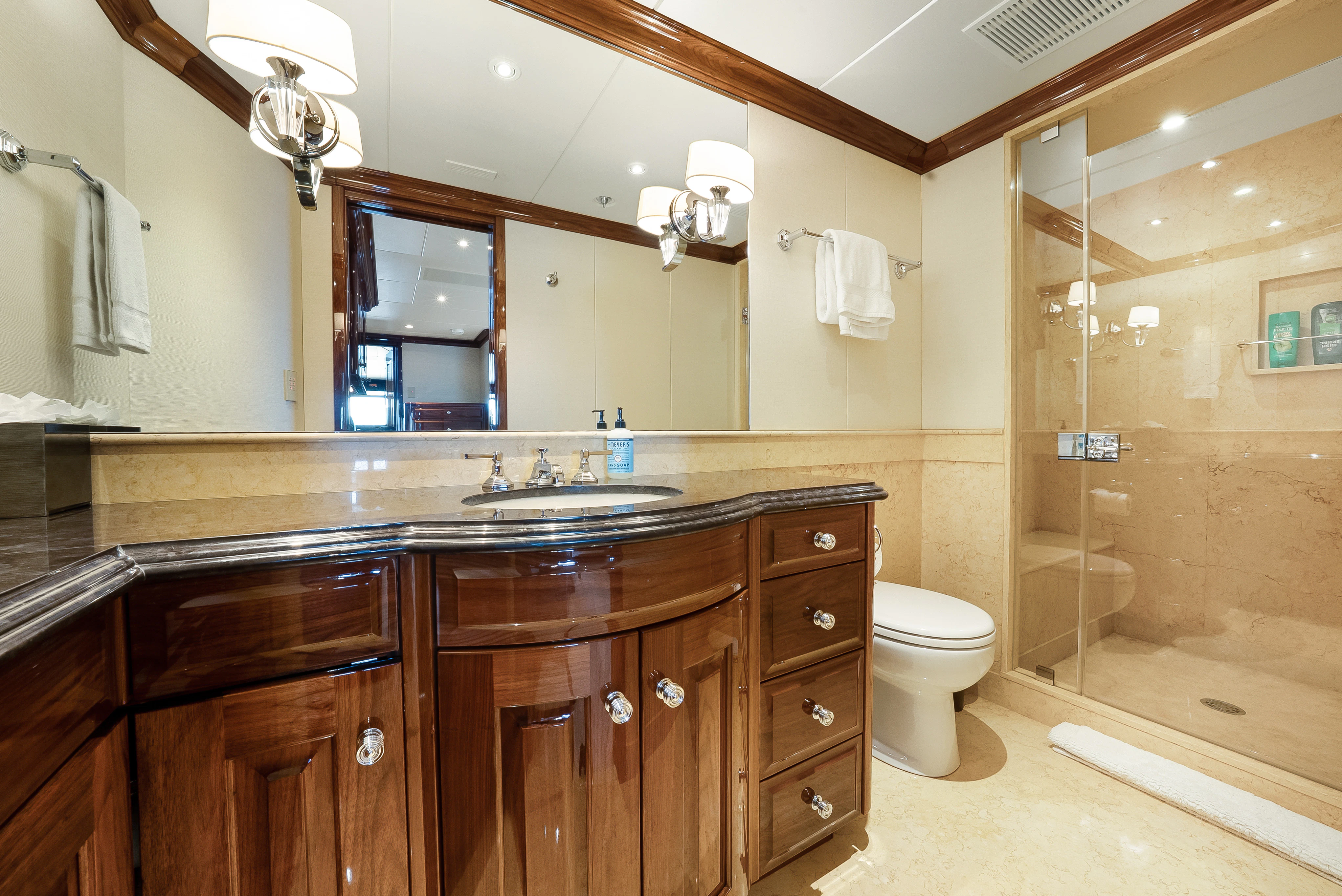 a bathroom with a glass shower aboard SILVER LINING Yacht for Sale