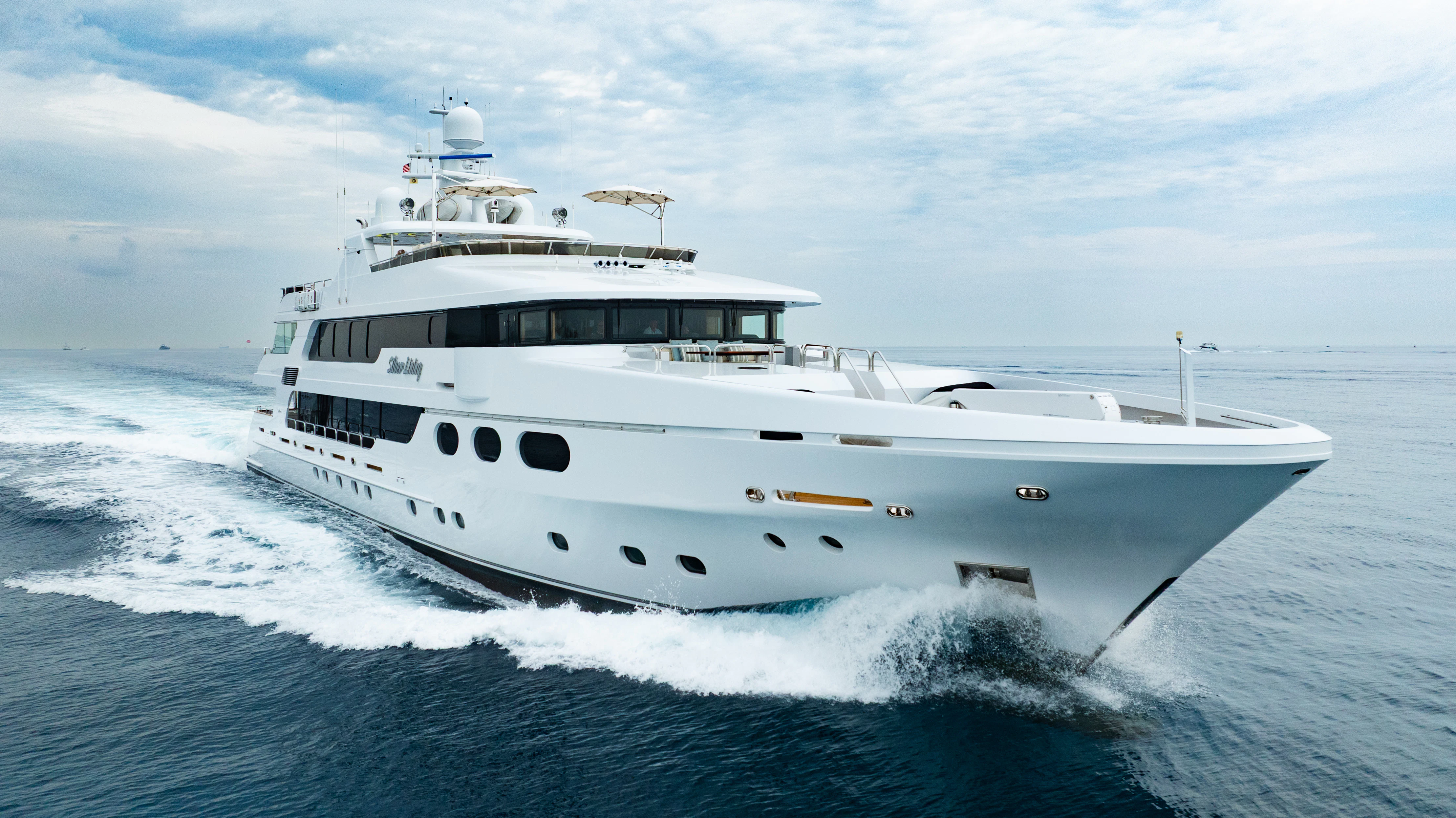 a white yacht on the water aboard SILVER LINING Yacht for Sale