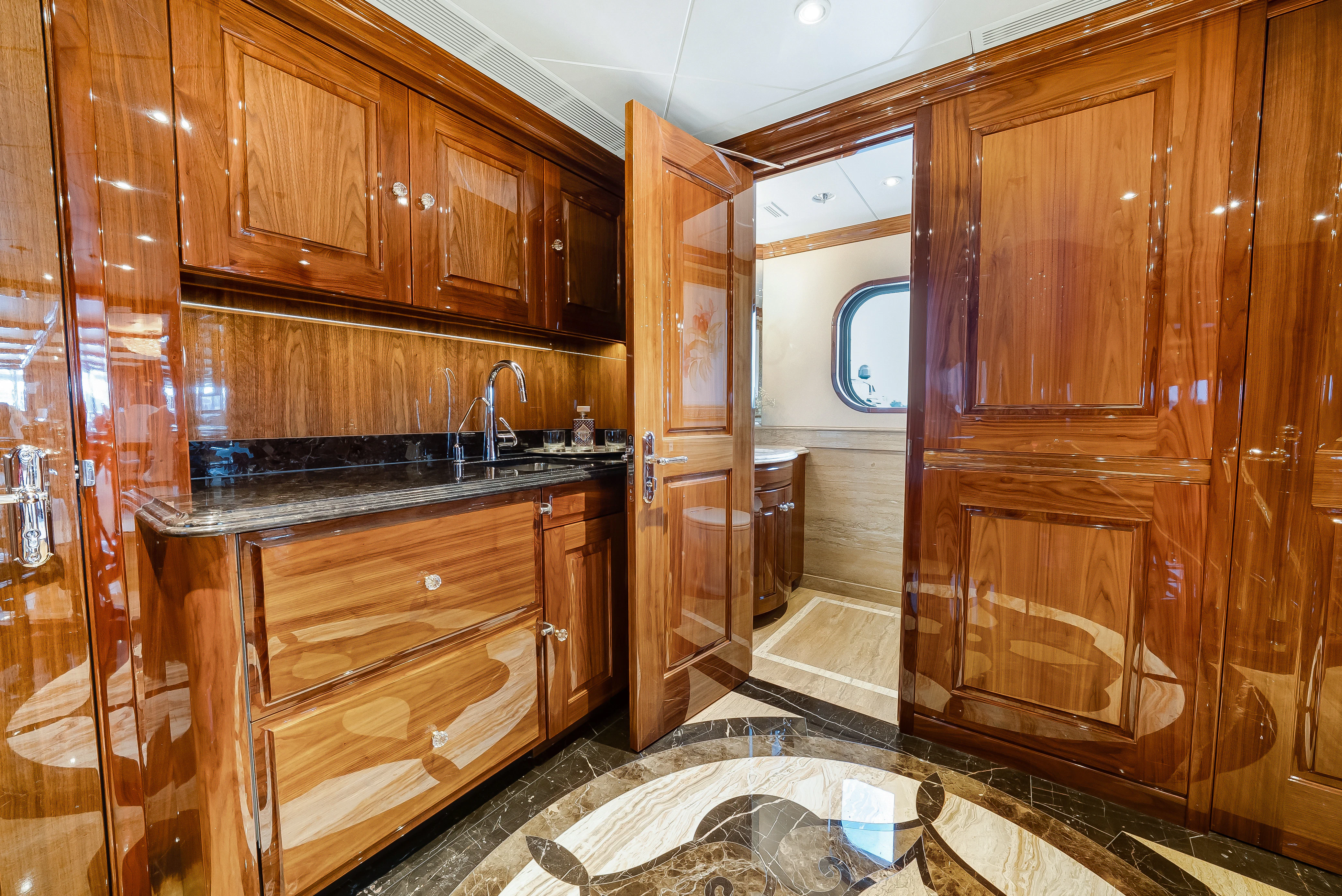 a kitchen with wooden cabinets aboard SILVER LINING Yacht for Sale