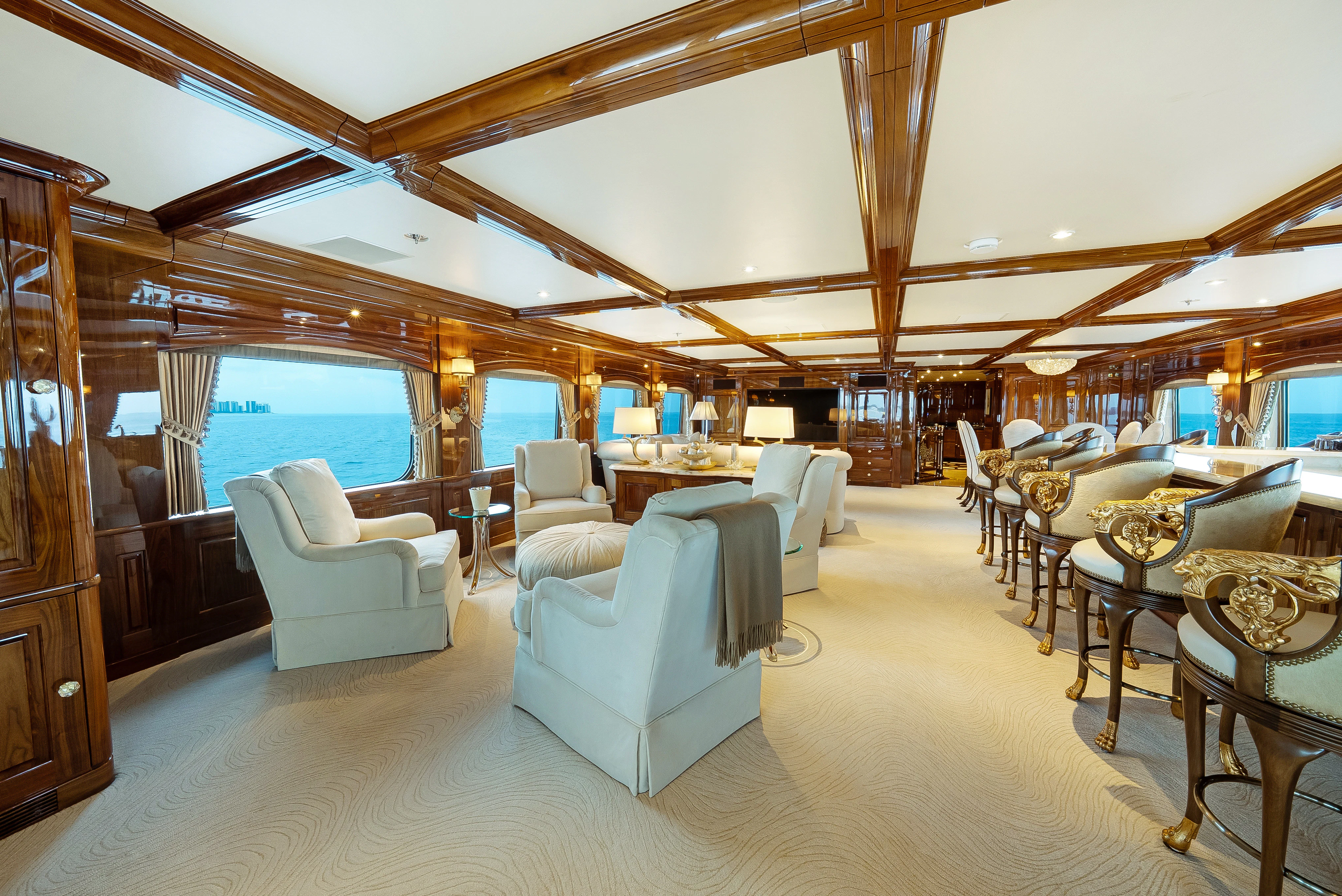 a large room with a large table and chairs aboard SILVER LINING Yacht for Sale