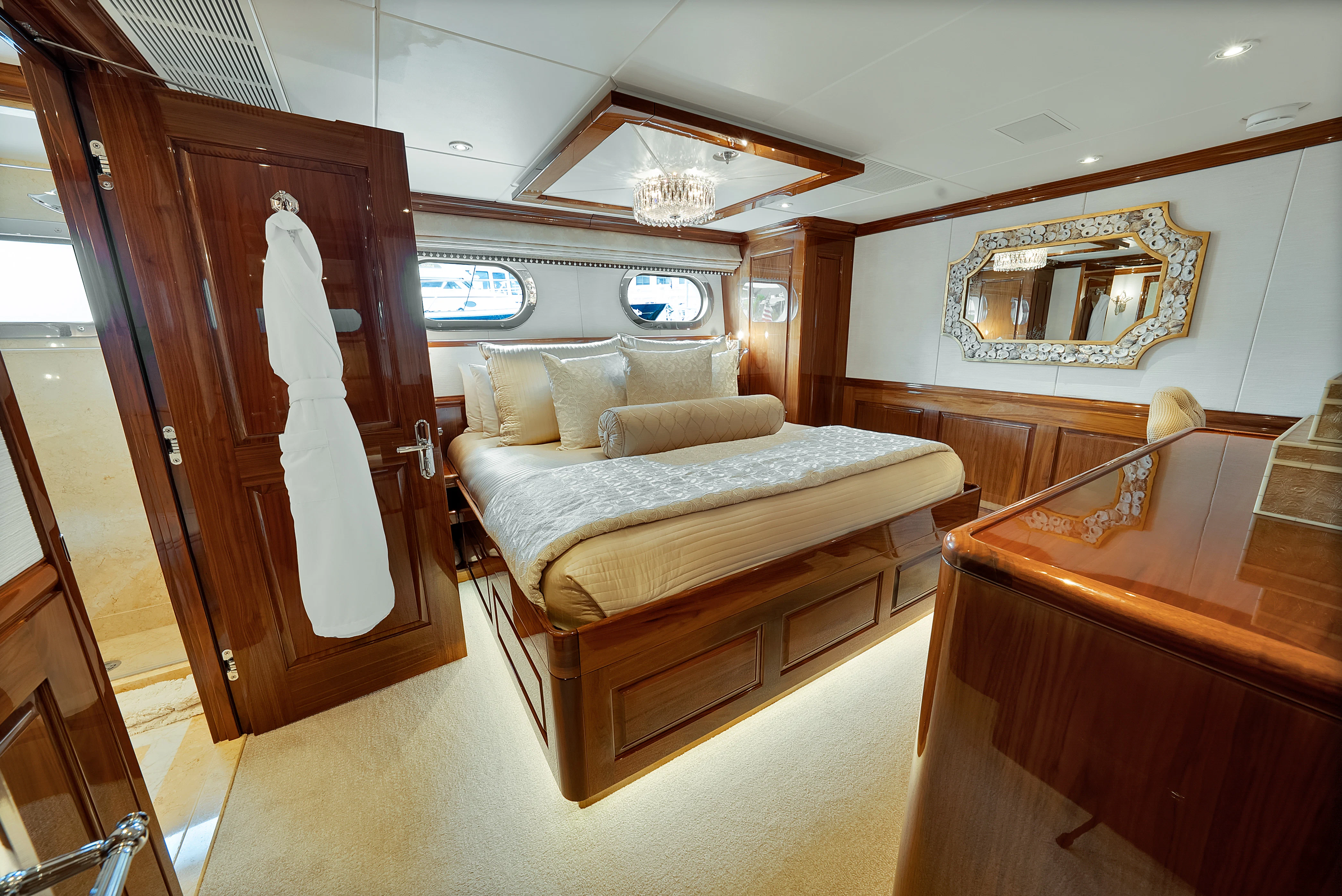 a bedroom with a bed and a desk aboard SILVER LINING Yacht for Sale
