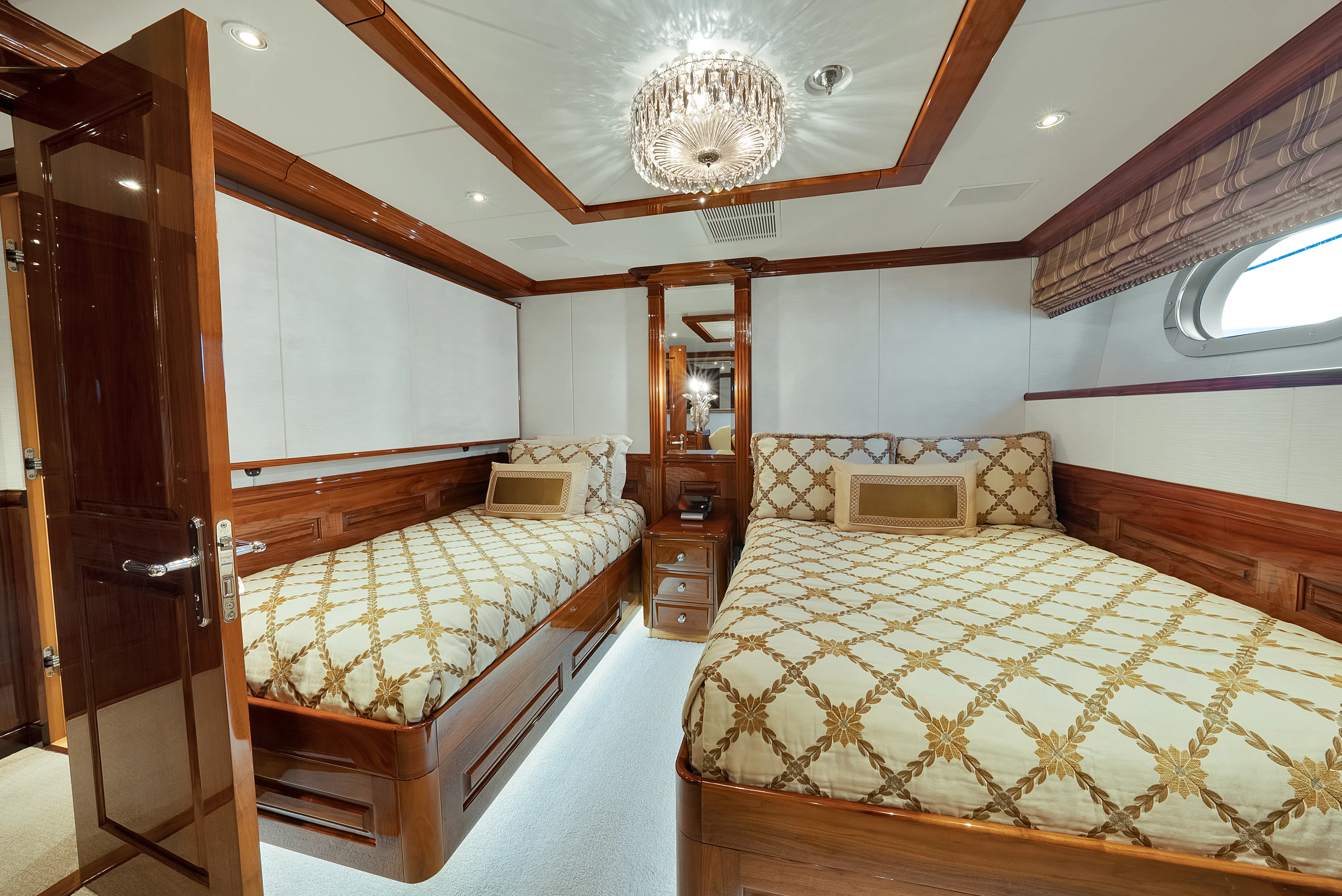 a bedroom with two beds aboard SILVER LINING Yacht for Sale