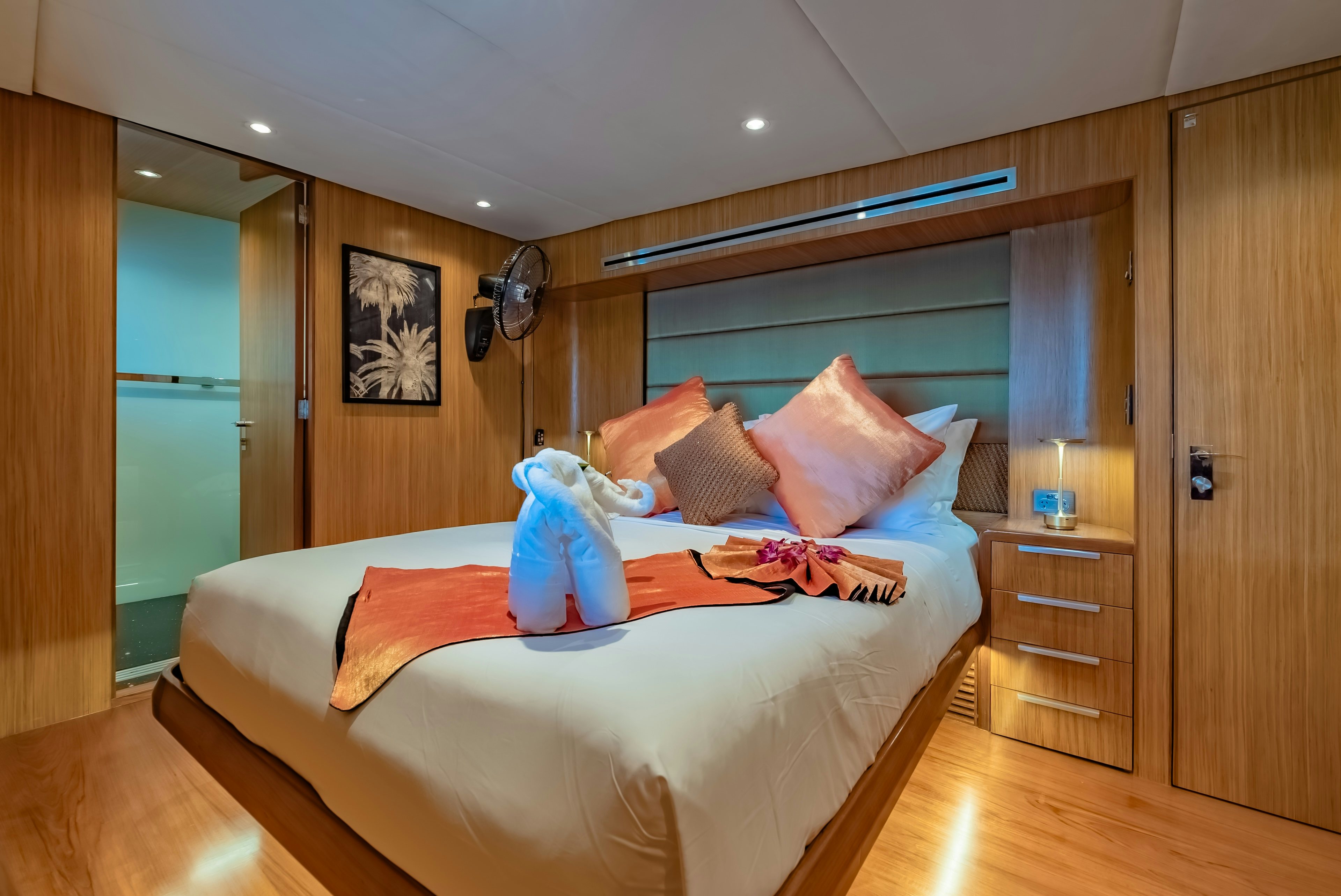a bedroom with a bed and a closet aboard THEA Yacht for Sale