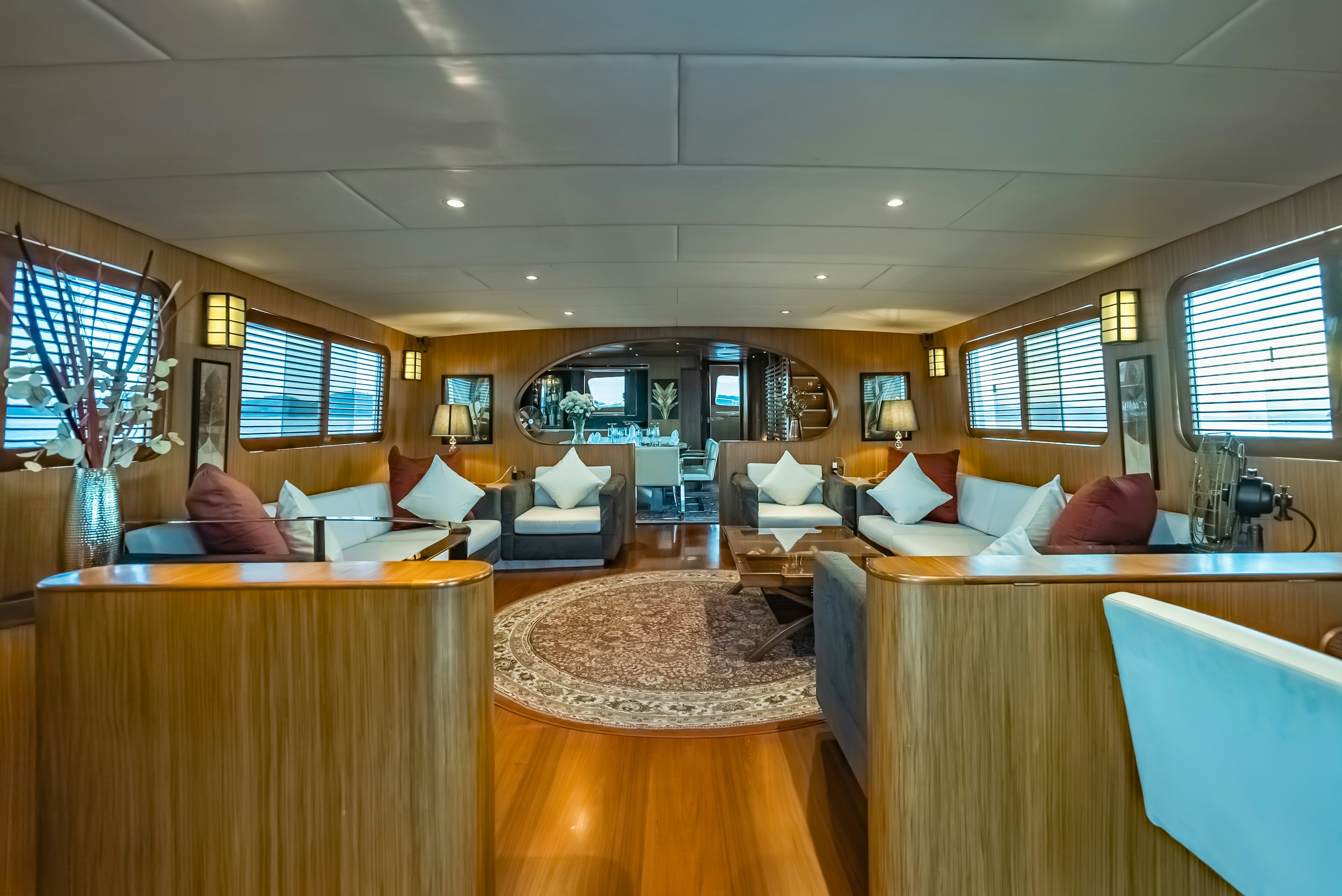 a large room with a bed and a couch aboard THEA Yacht for Sale