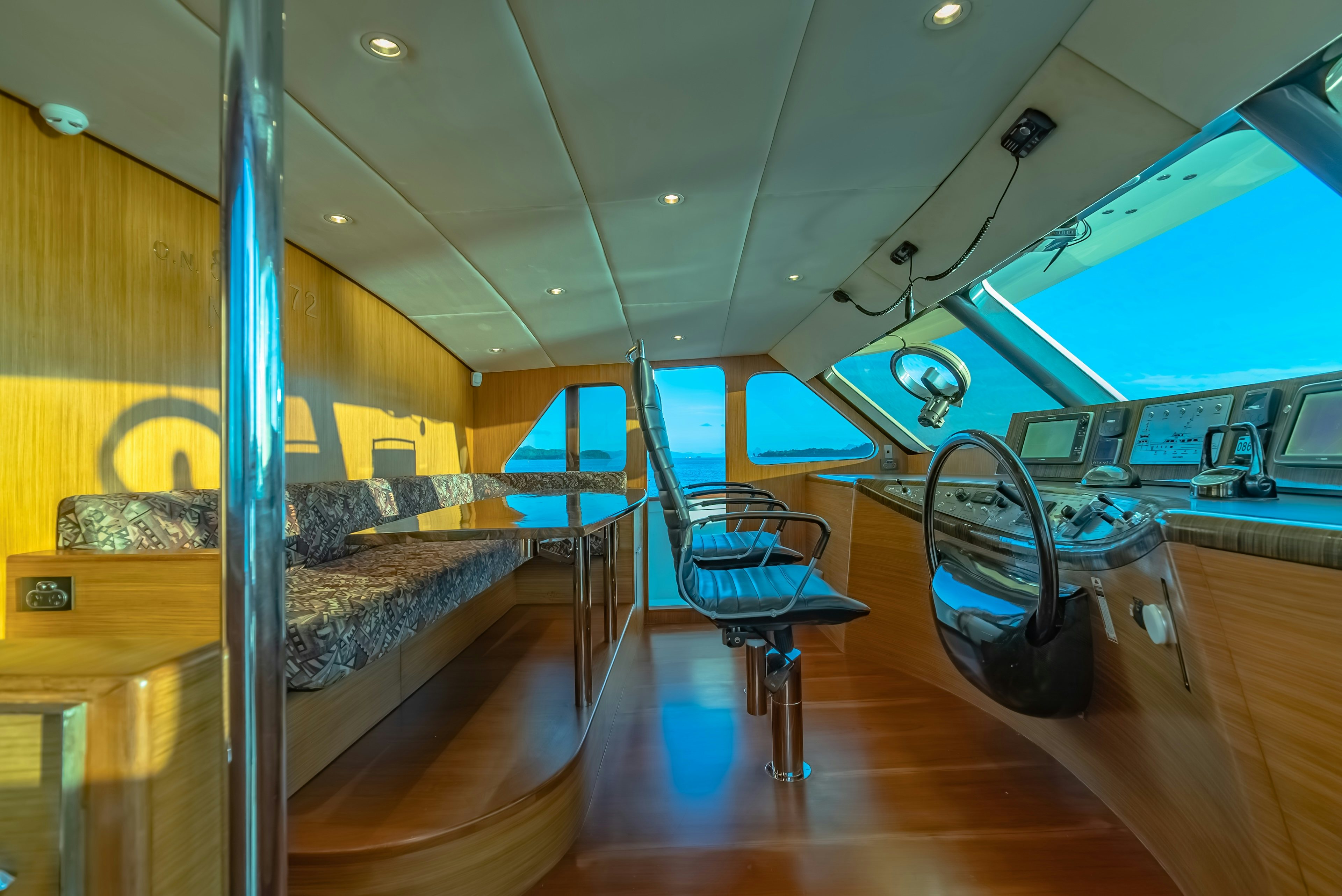 a room with a bed and a desk aboard THEA Yacht for Sale