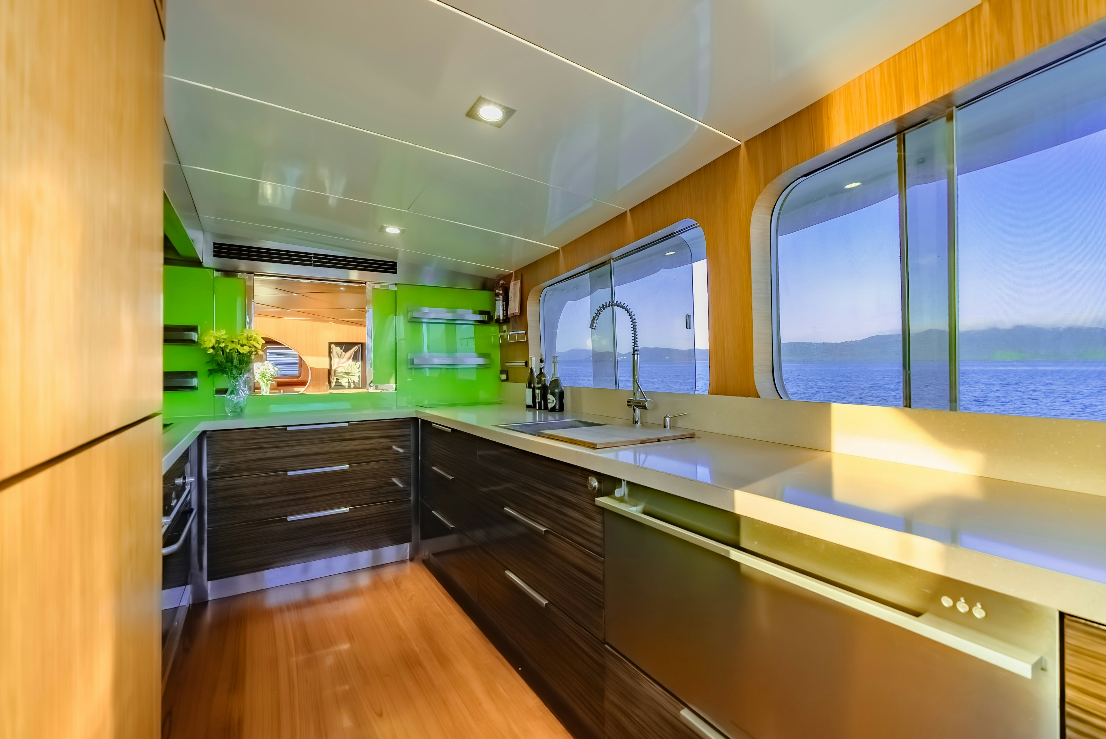 a kitchen with a sink and cabinets aboard THEA Yacht for Sale