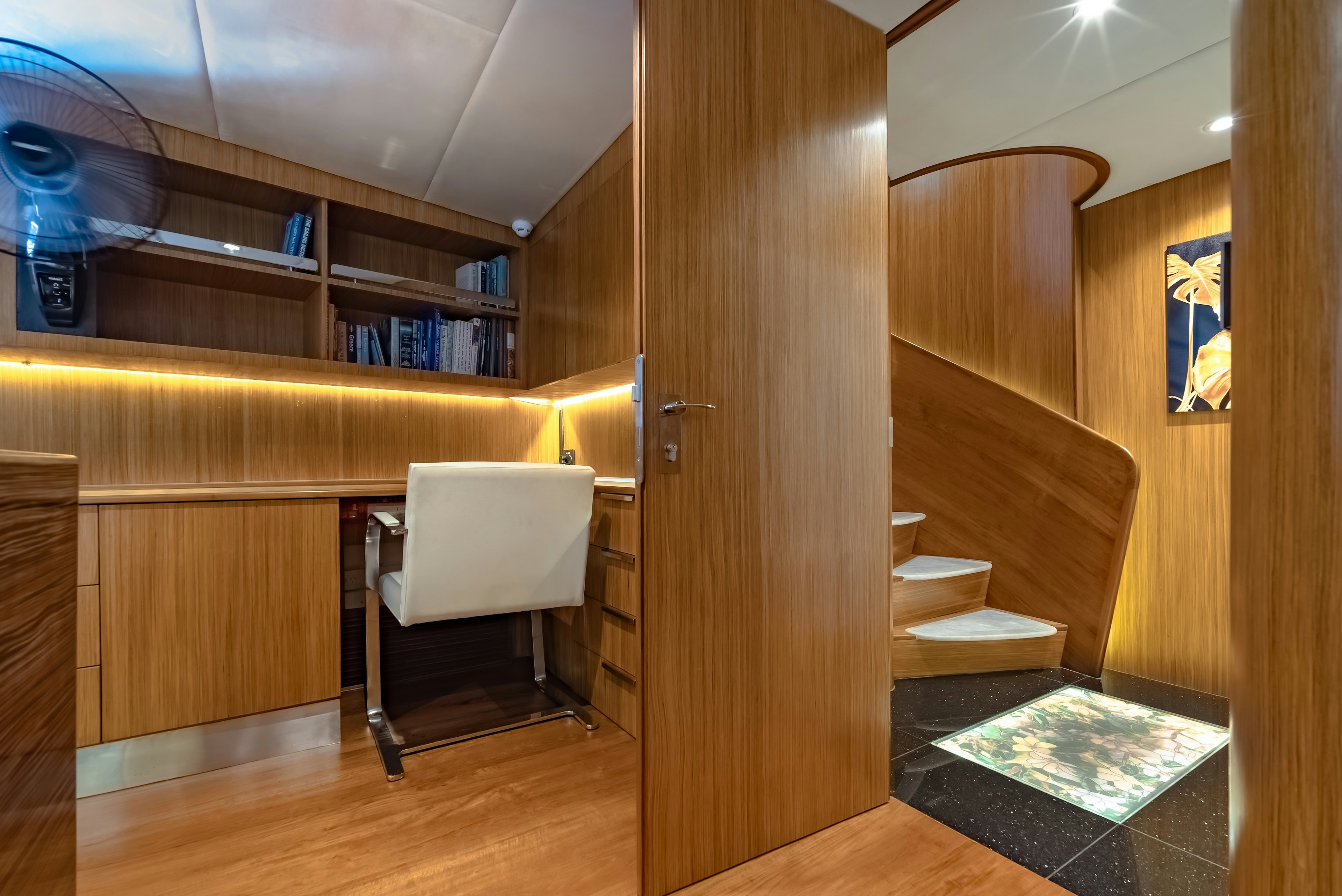 a room with a chair and a table aboard THEA Yacht for Sale