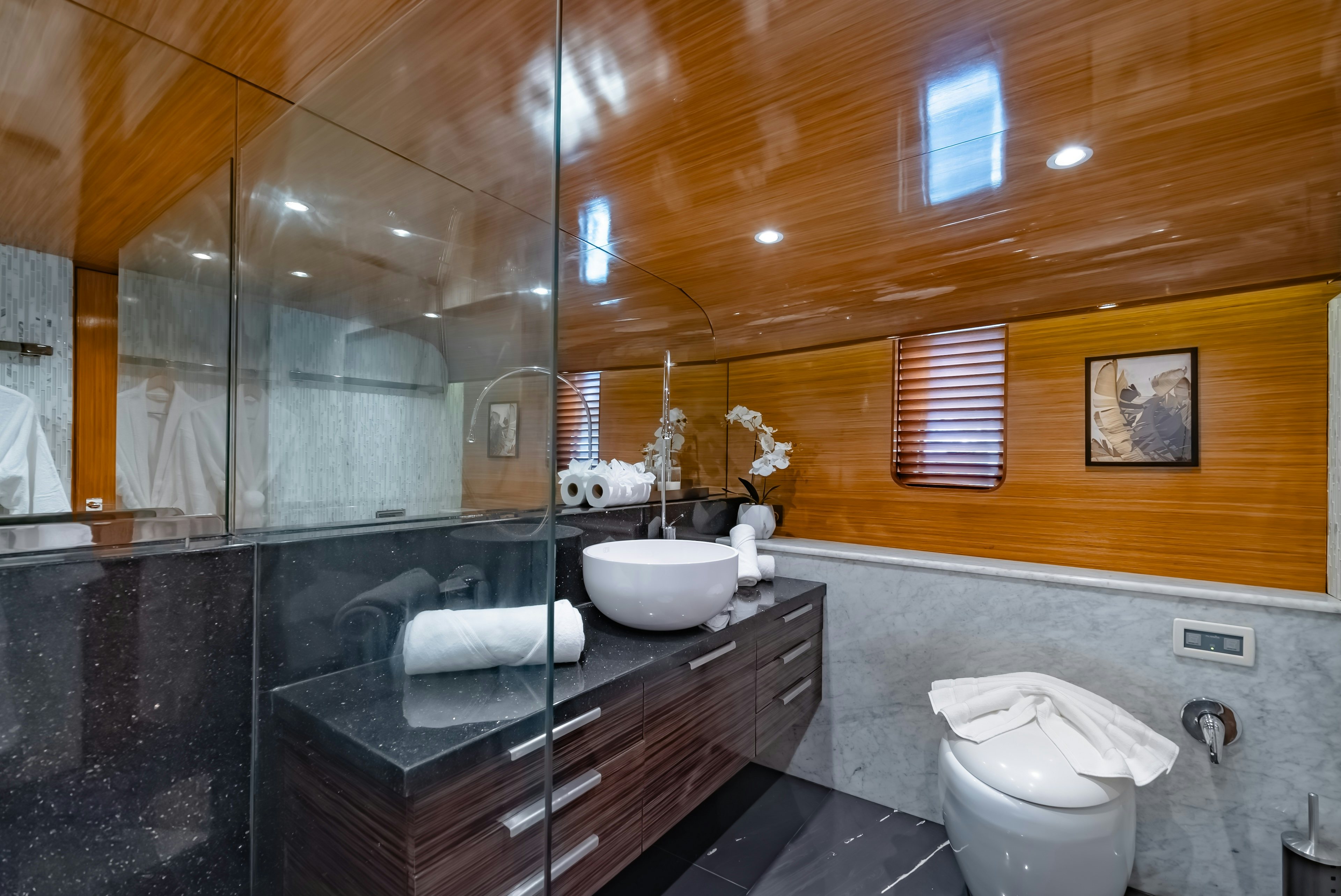 a bathroom with a large mirror aboard THEA Yacht for Sale