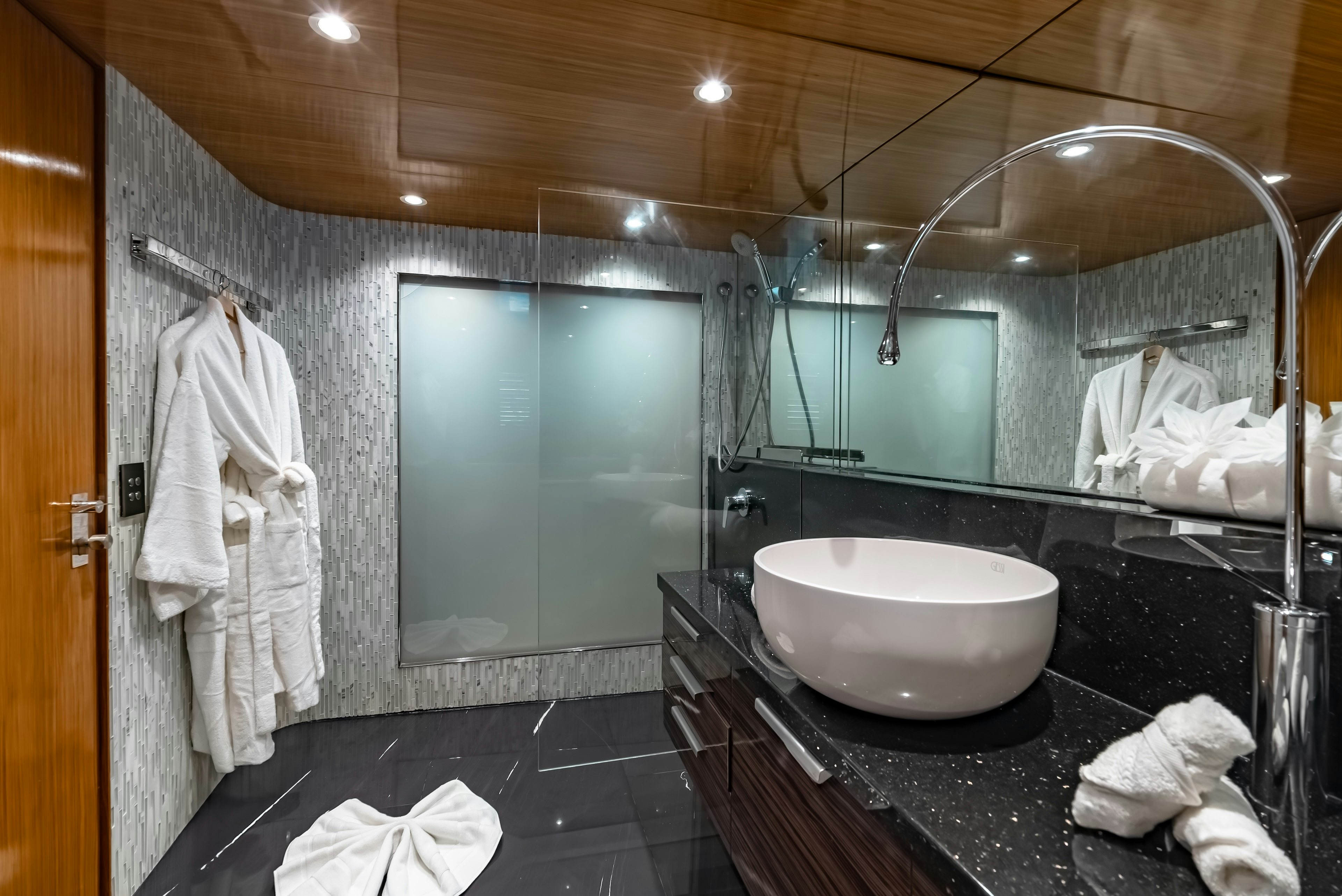 a bathroom with a large mirror aboard THEA Yacht for Sale