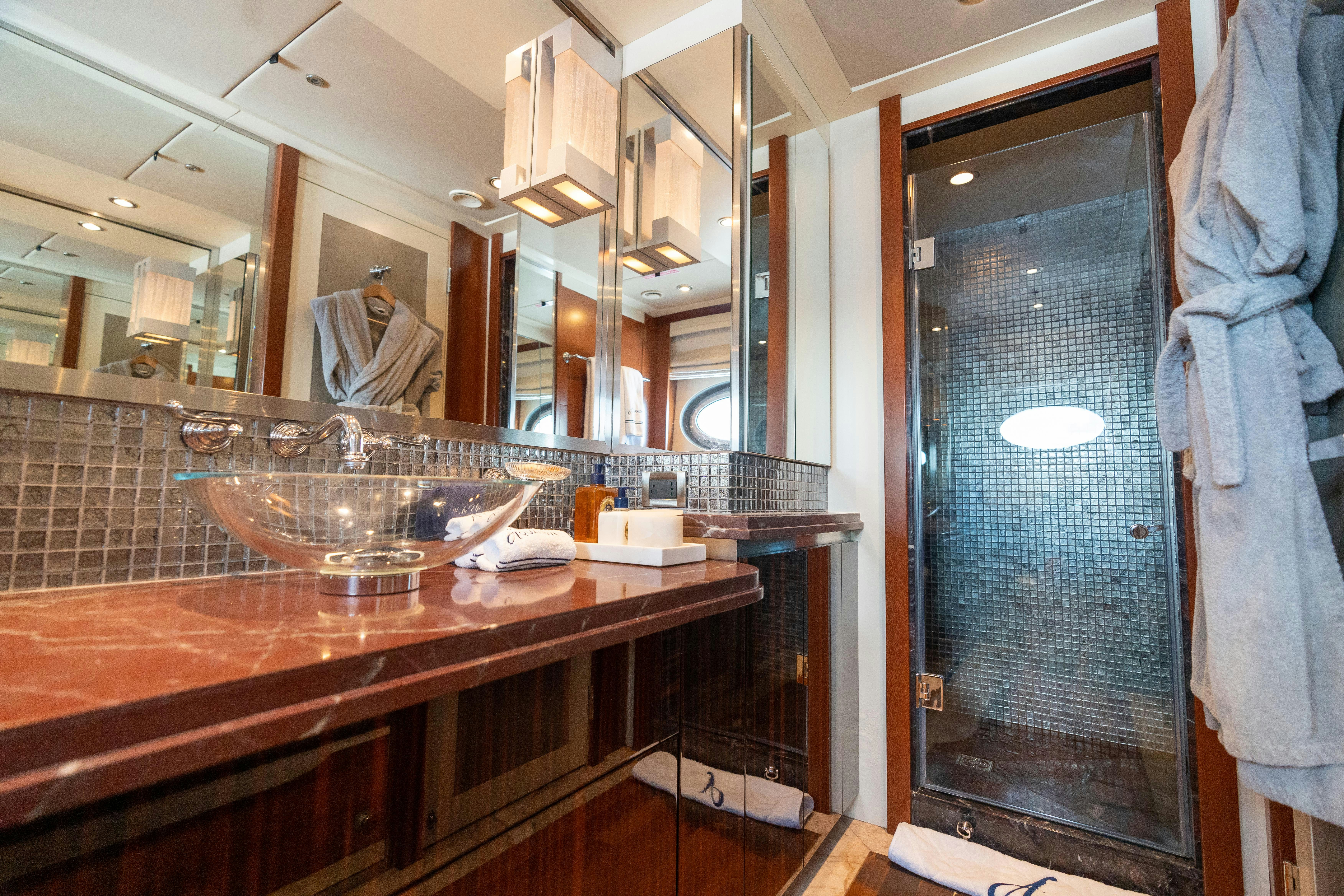 a bathroom with a sink and a mirror aboard AQUANOVA Yacht for Charter