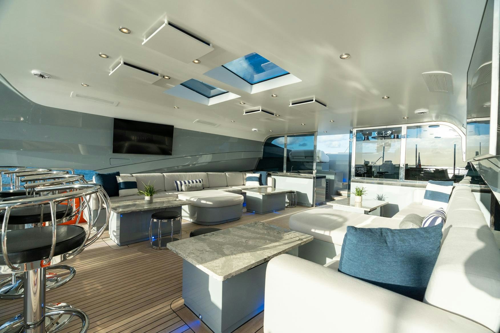 inside of a room with a table and chairs aboard AQUANOVA Yacht for Charter