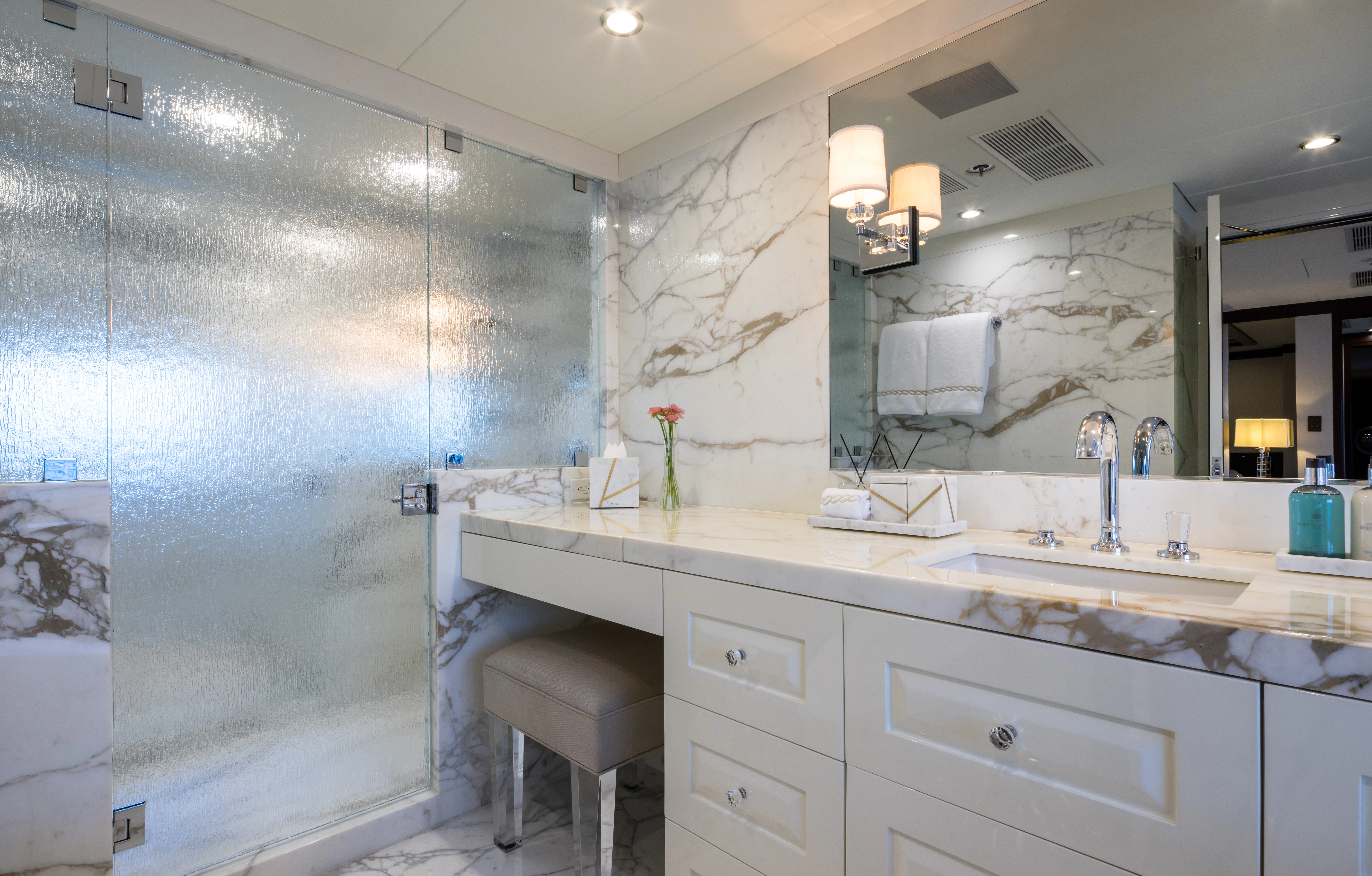 a bathroom with a glass shower aboard MISS MICHELLE Yacht for Charter
