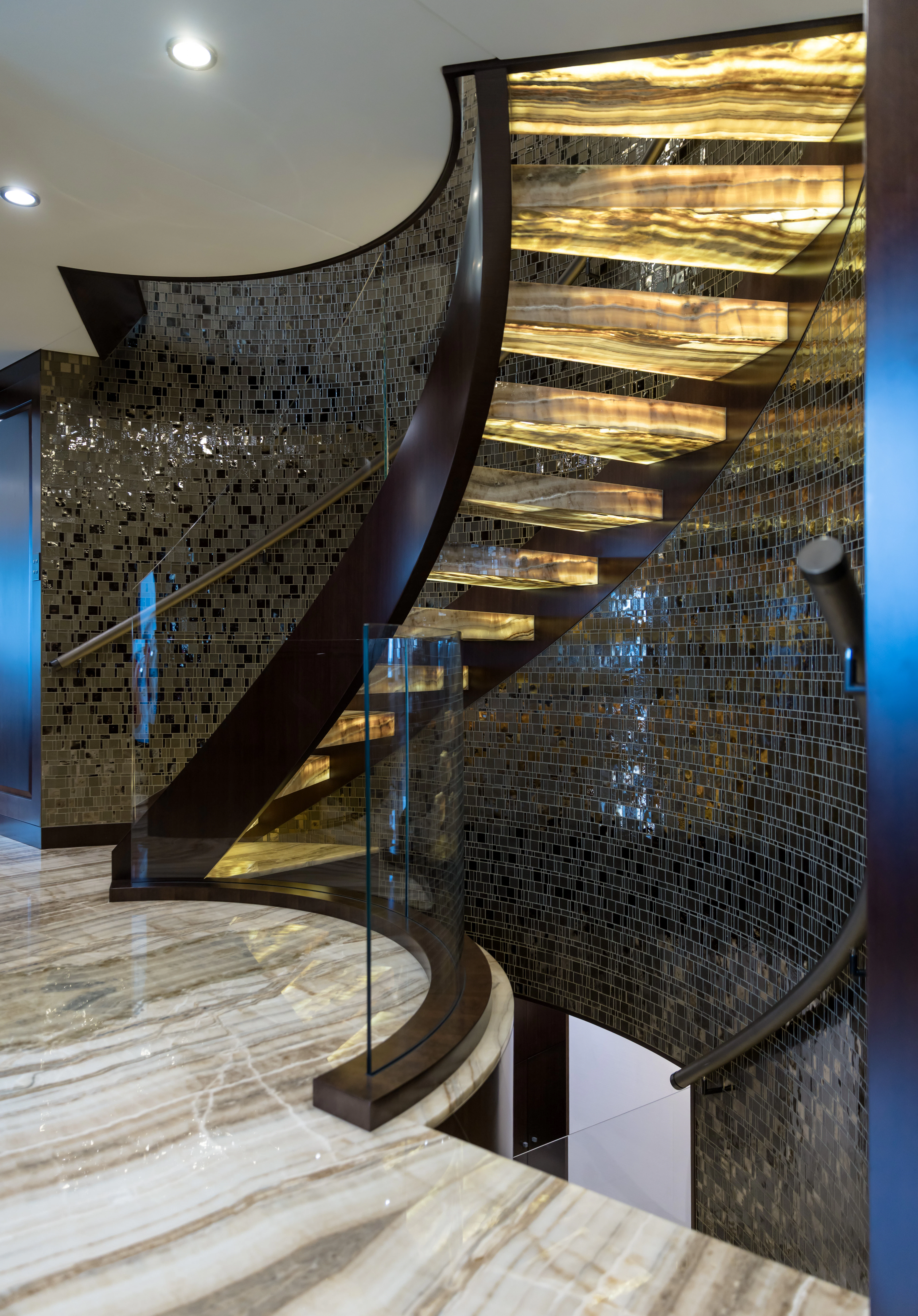 a spiral staircase with a blue railing aboard MISS MICHELLE Yacht for Charter