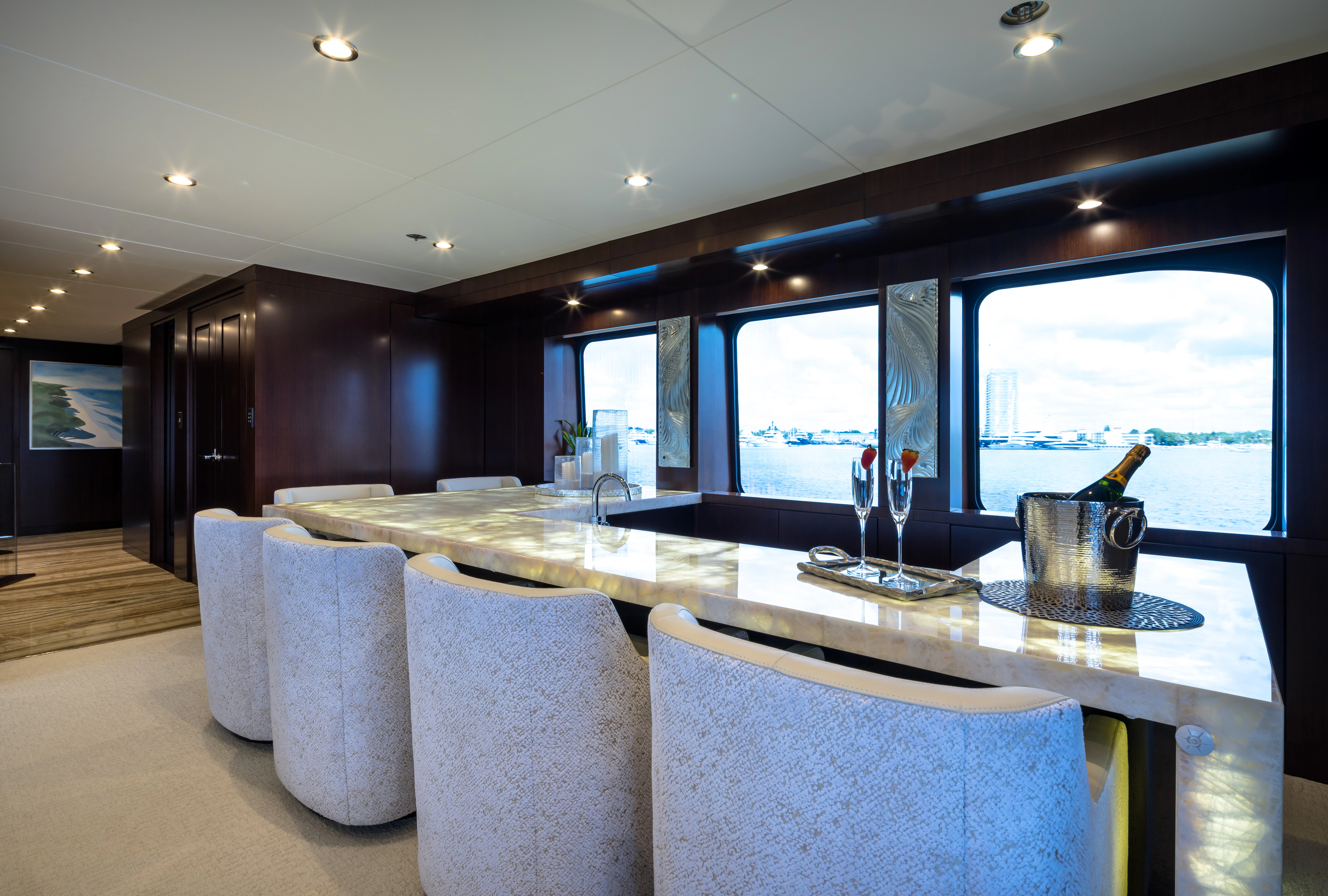 a dining room with a large window aboard MISS MICHELLE Yacht for Charter