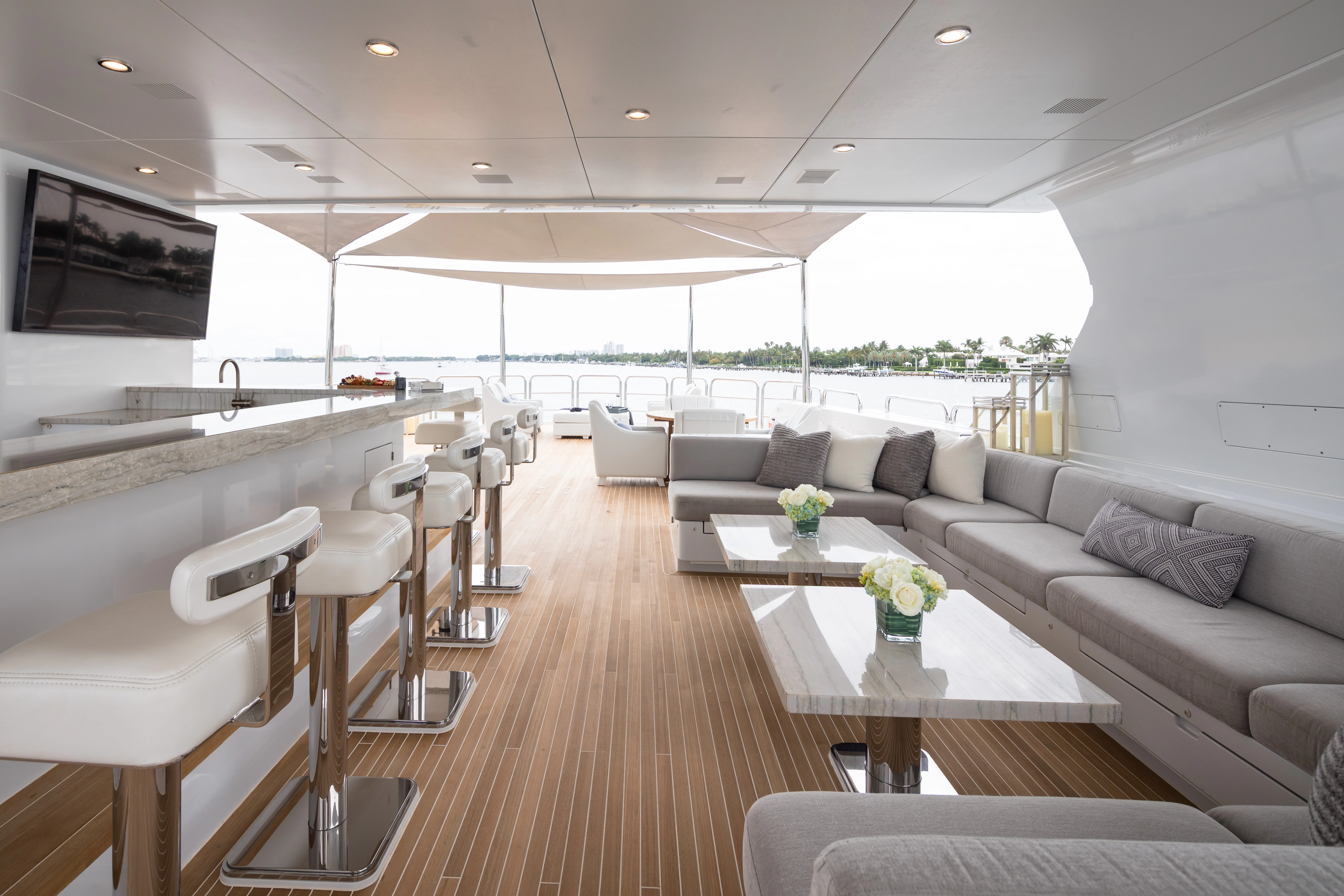 a living room with a large window aboard MISS MICHELLE Yacht for Charter