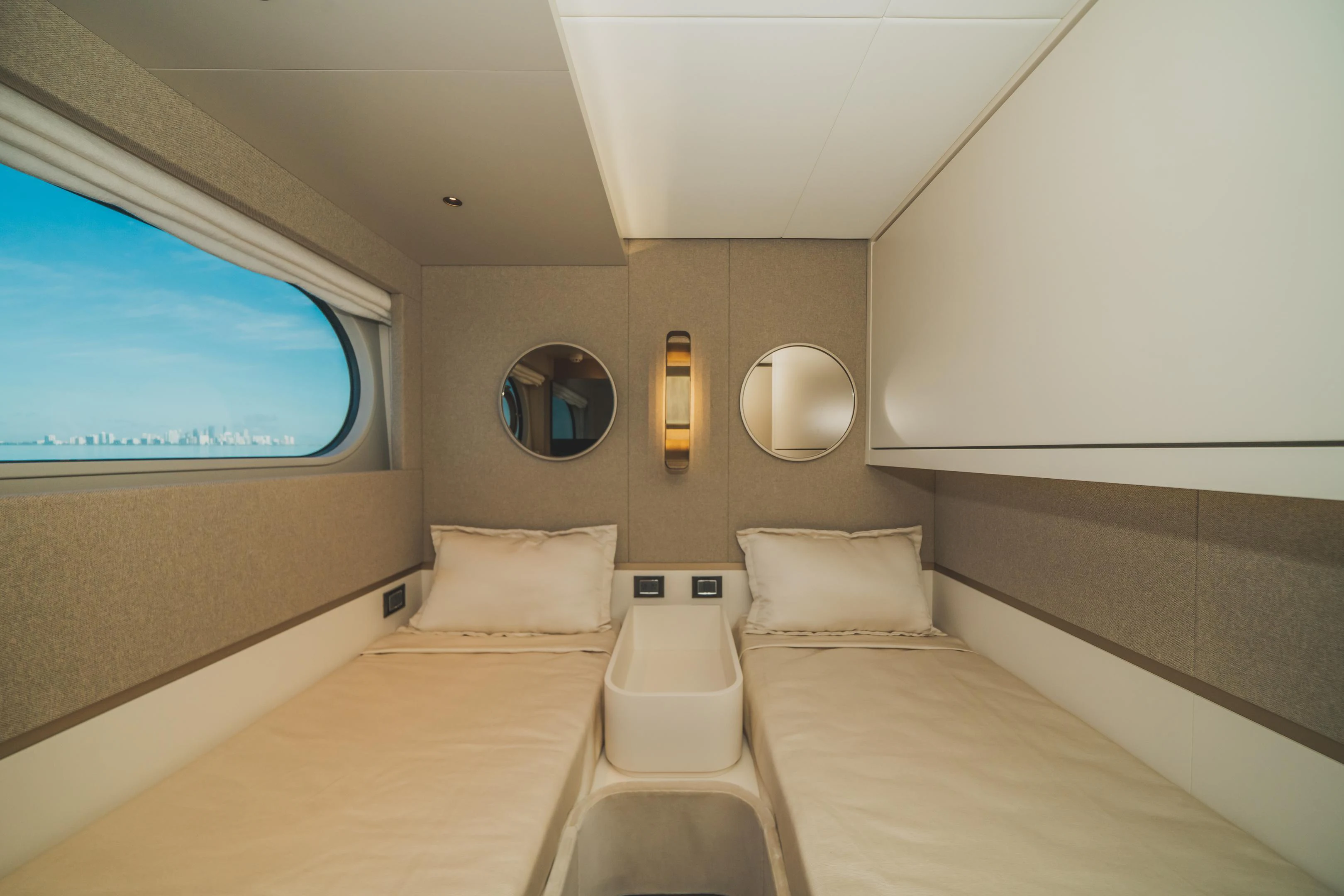 a room with a bed and a large mirror aboard GUBA TIMES Yacht for Charter