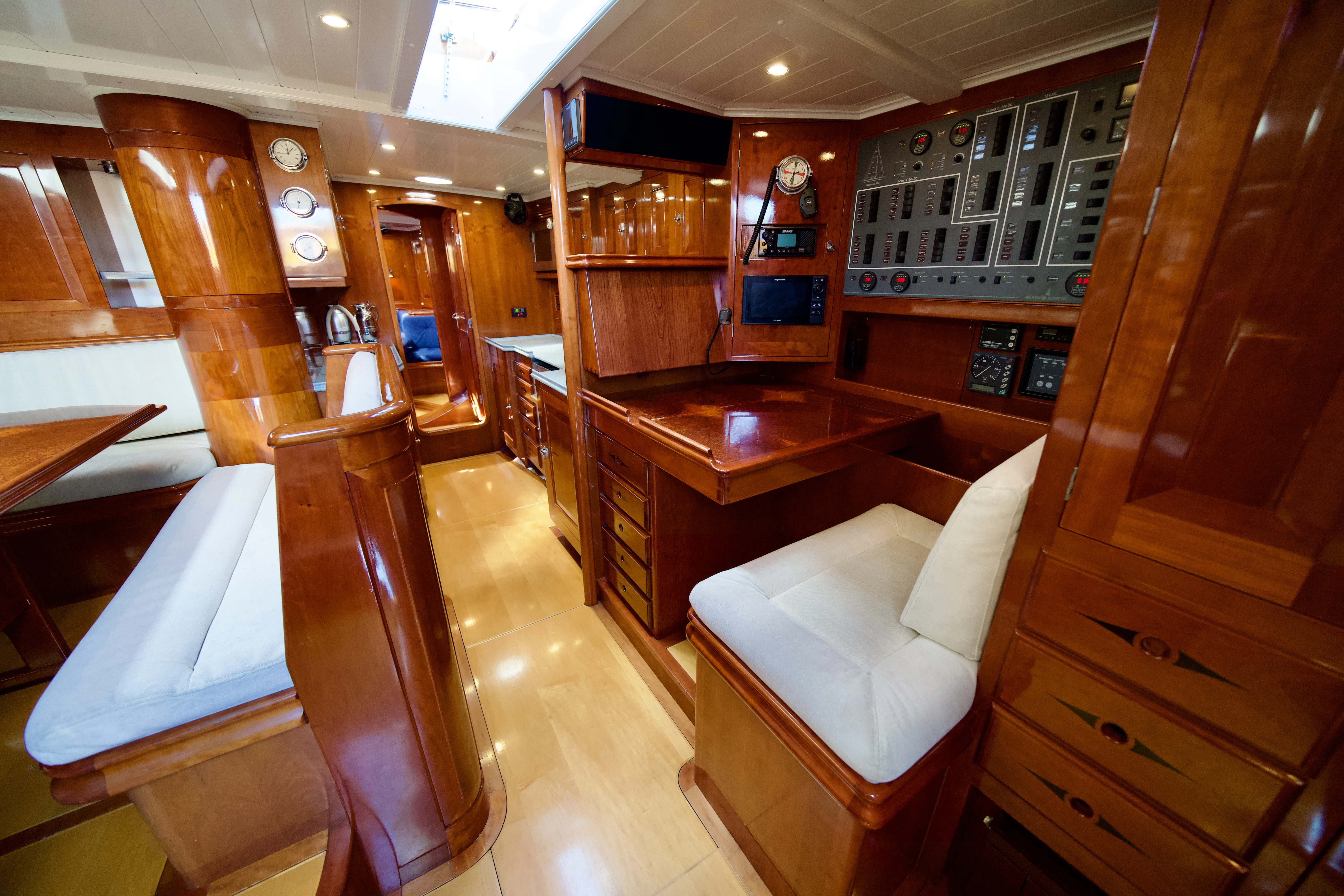 a room with wooden cabinets and a table and chairs aboard ISABEL Yacht for Sale