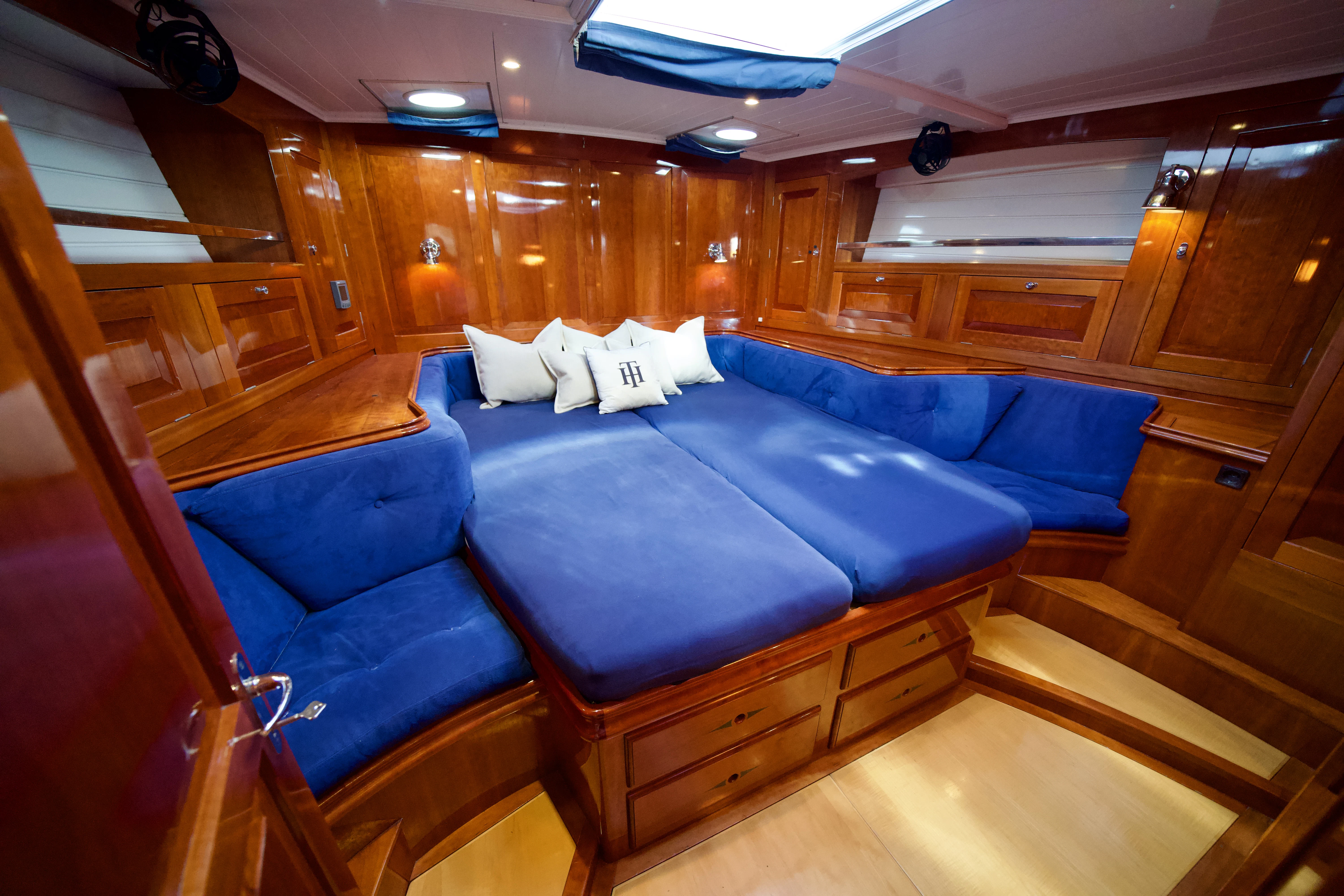 a room with a couch and a wood wall aboard ISABEL Yacht for Sale