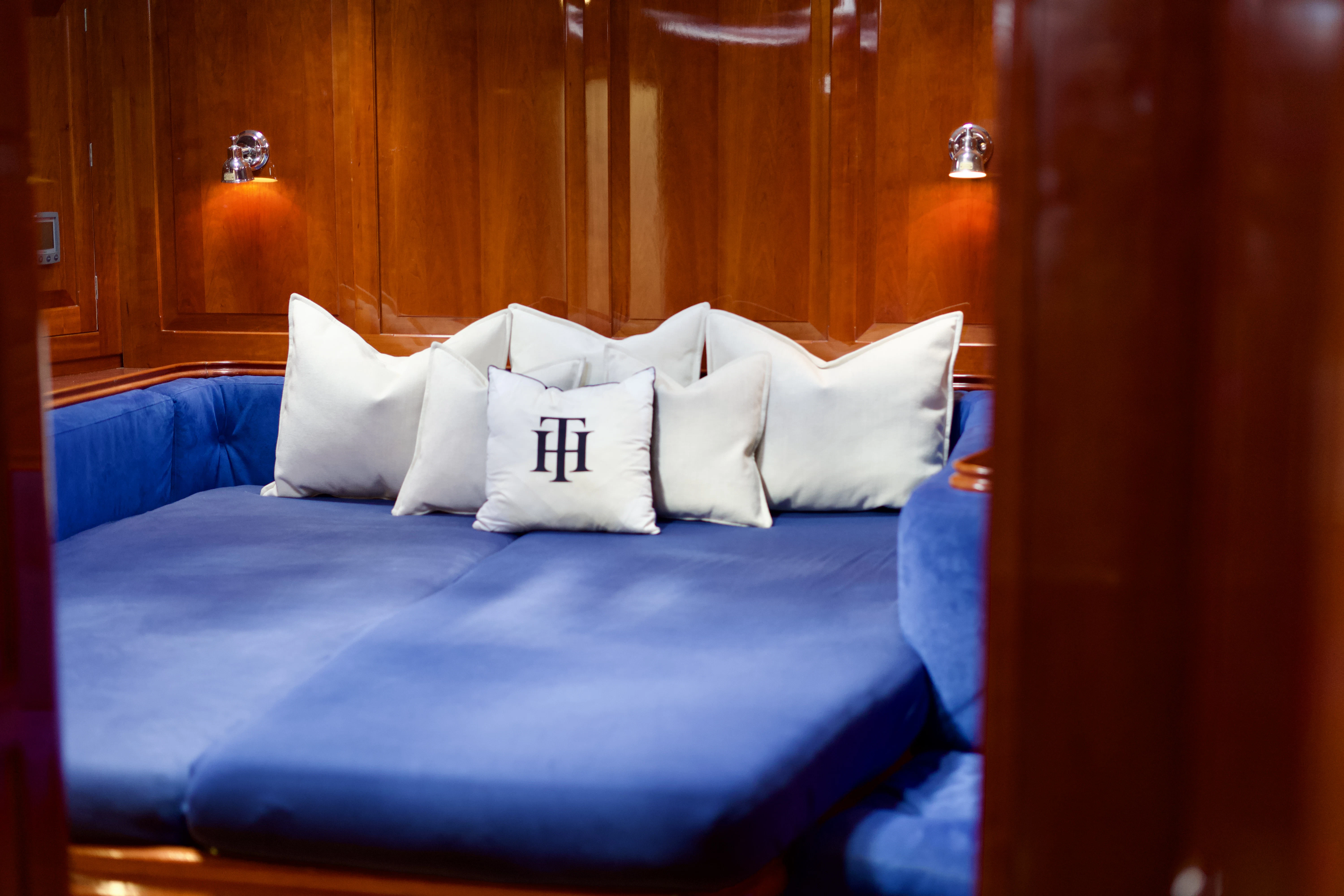a bed with white pillows aboard ISABEL Yacht for Sale