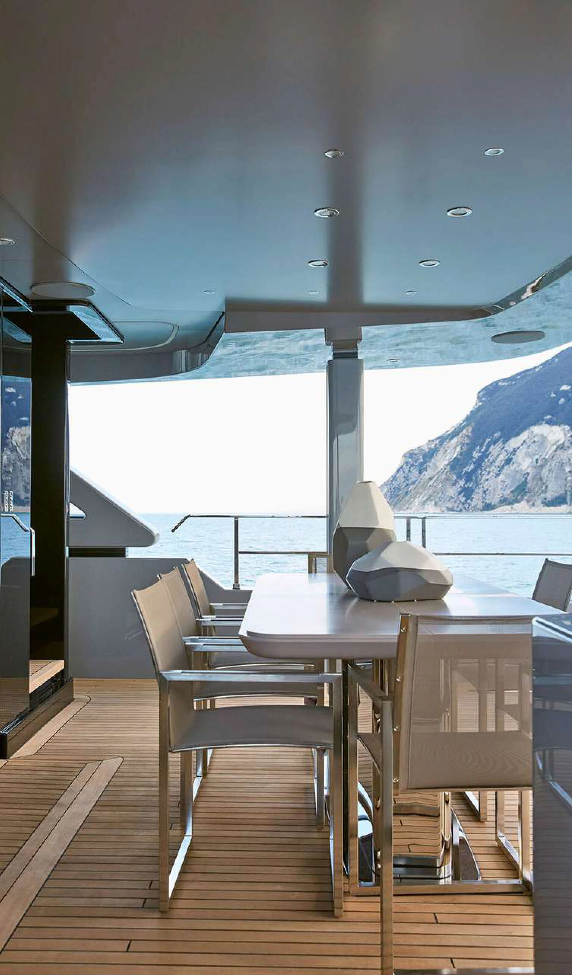 a table and chairs on a deck aboard PAZIENZA Yacht for Charter