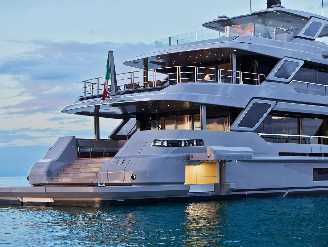 a large cruise ship docked aboard PAZIENZA Yacht for Charter