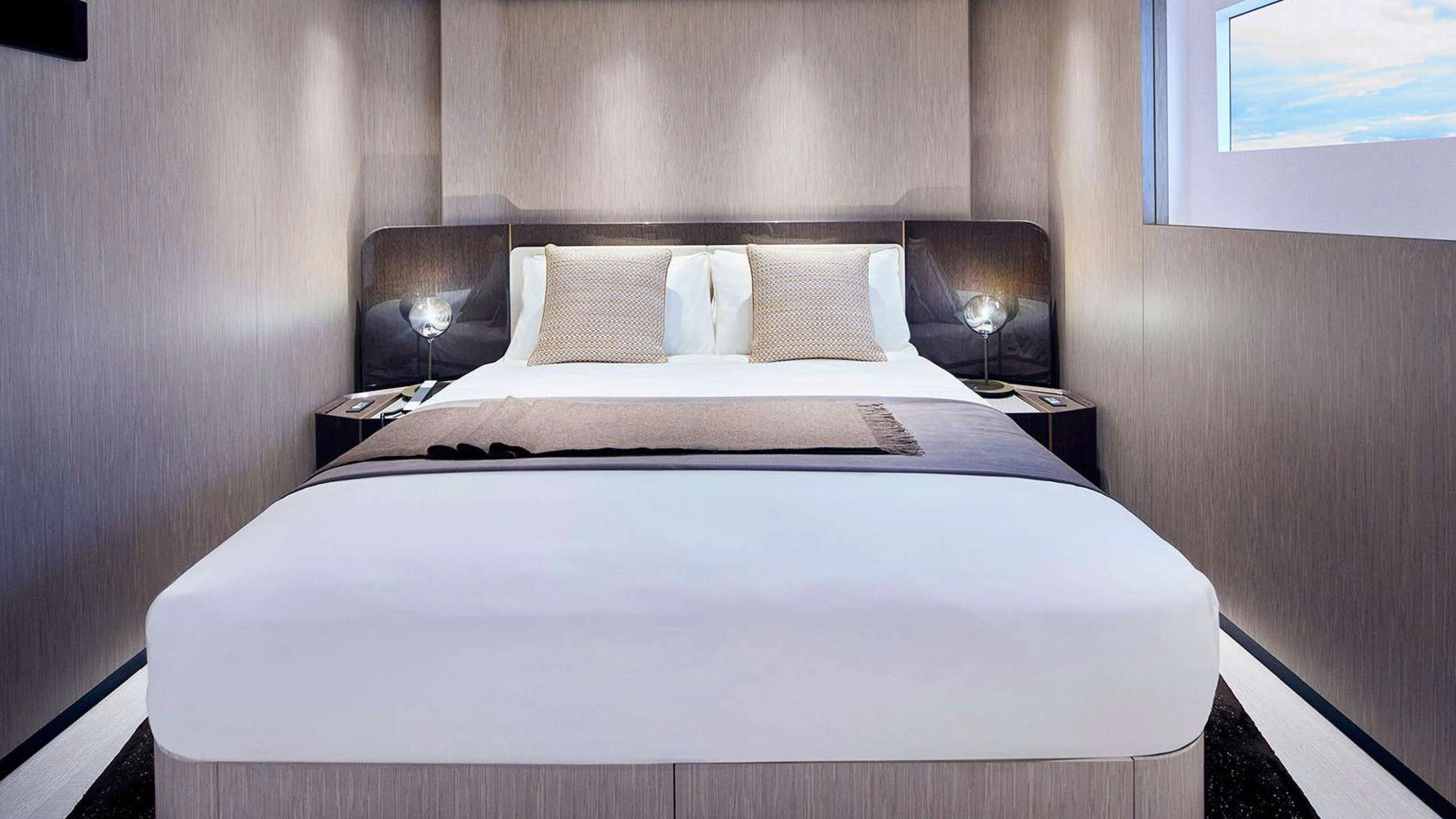 a bed with white sheets aboard PAZIENZA Yacht for Charter