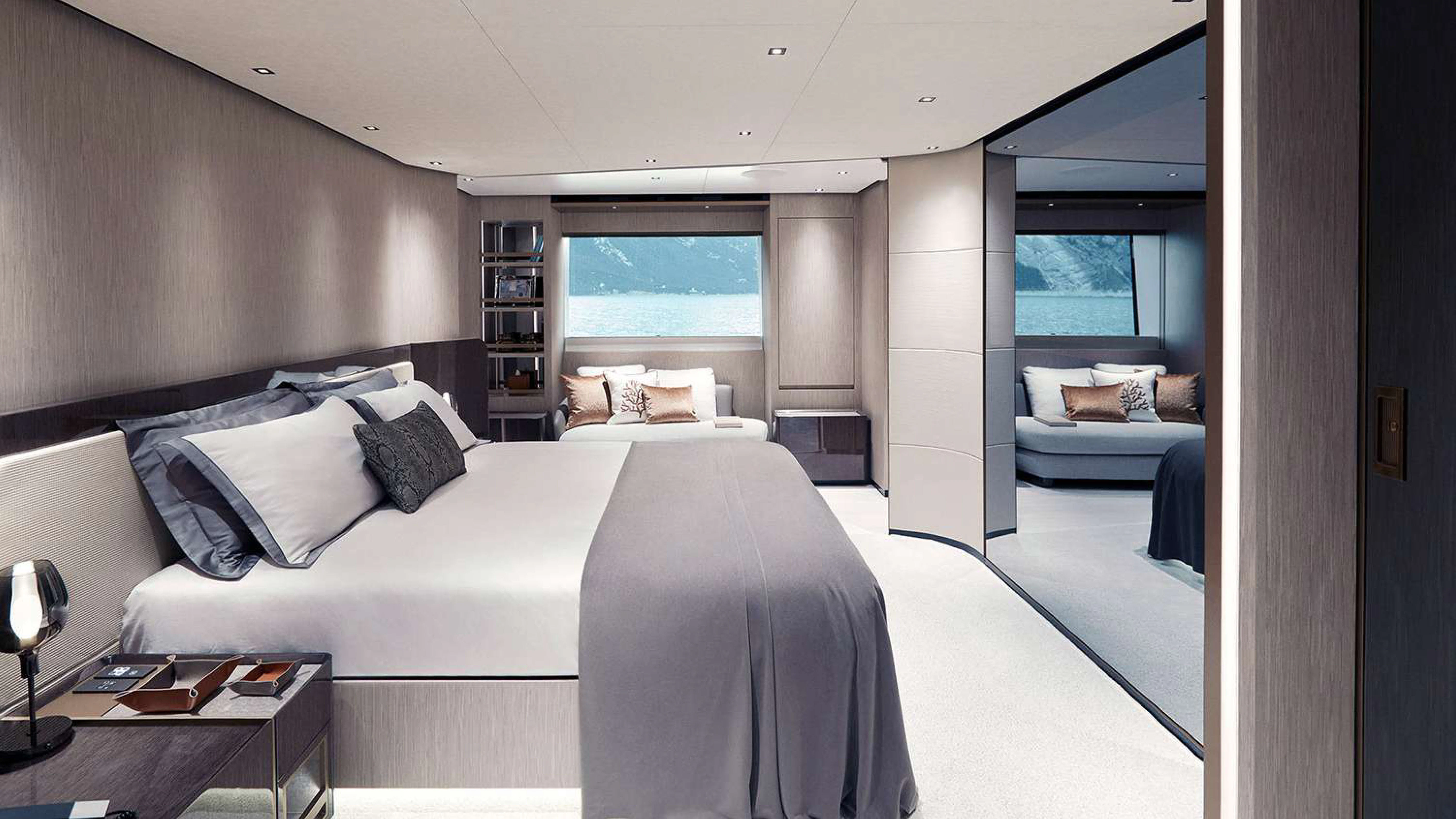 a bedroom with a bed and a desk aboard PAZIENZA Yacht for Charter