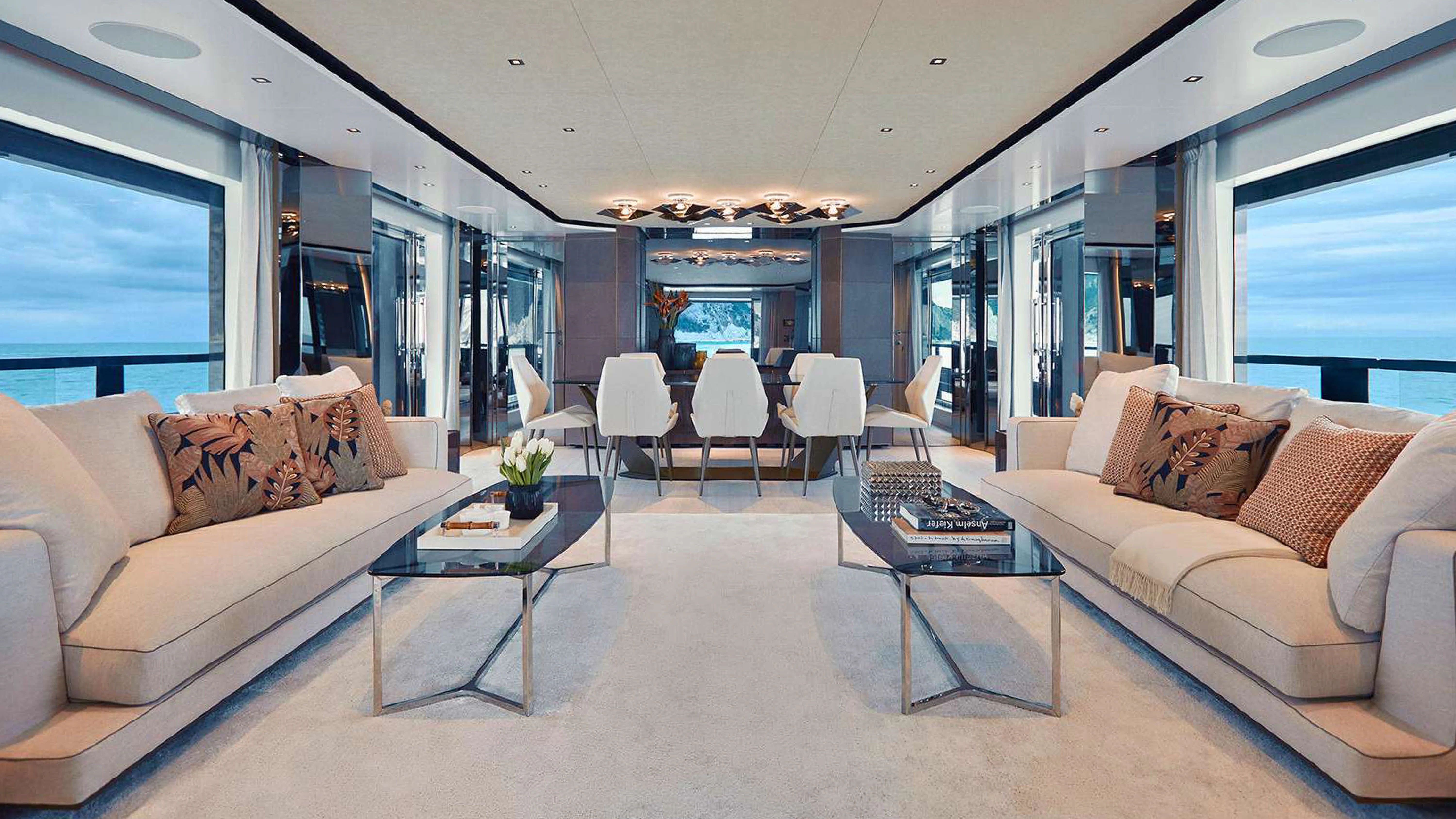 a living room with a couch and a table aboard PAZIENZA Yacht for Charter