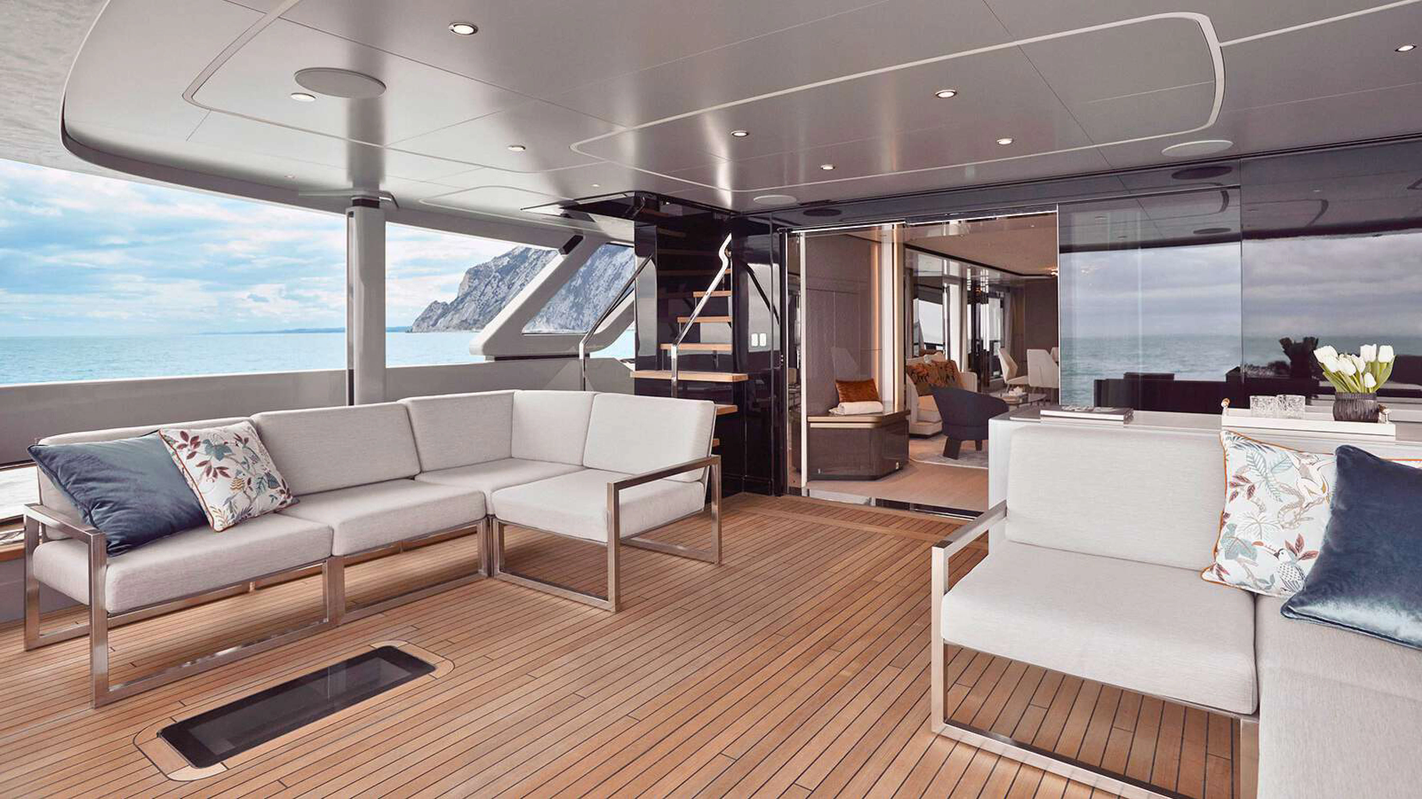 a living room with a large window aboard PAZIENZA Yacht for Charter