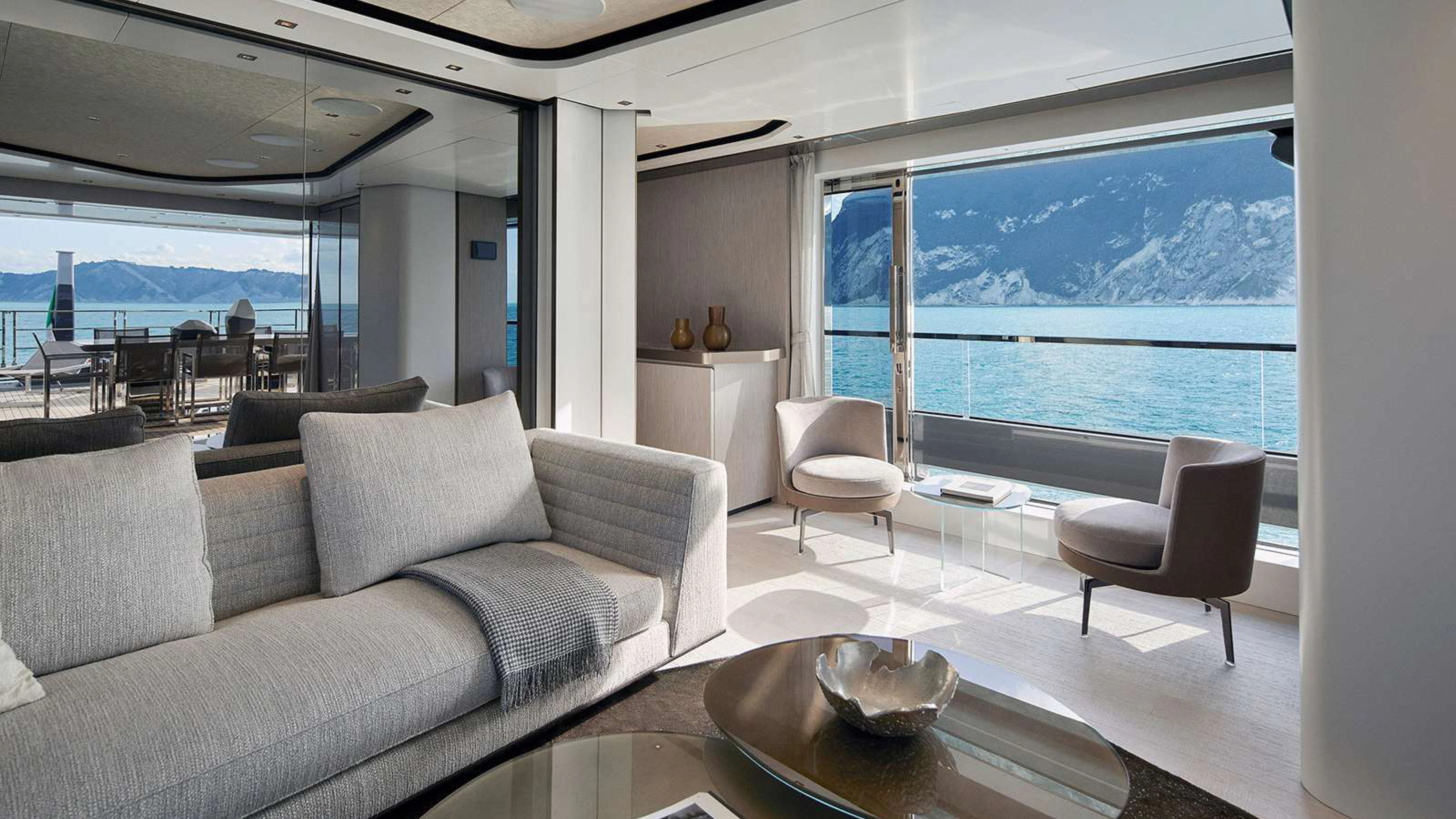 a living room with a large window aboard PAZIENZA Yacht for Charter