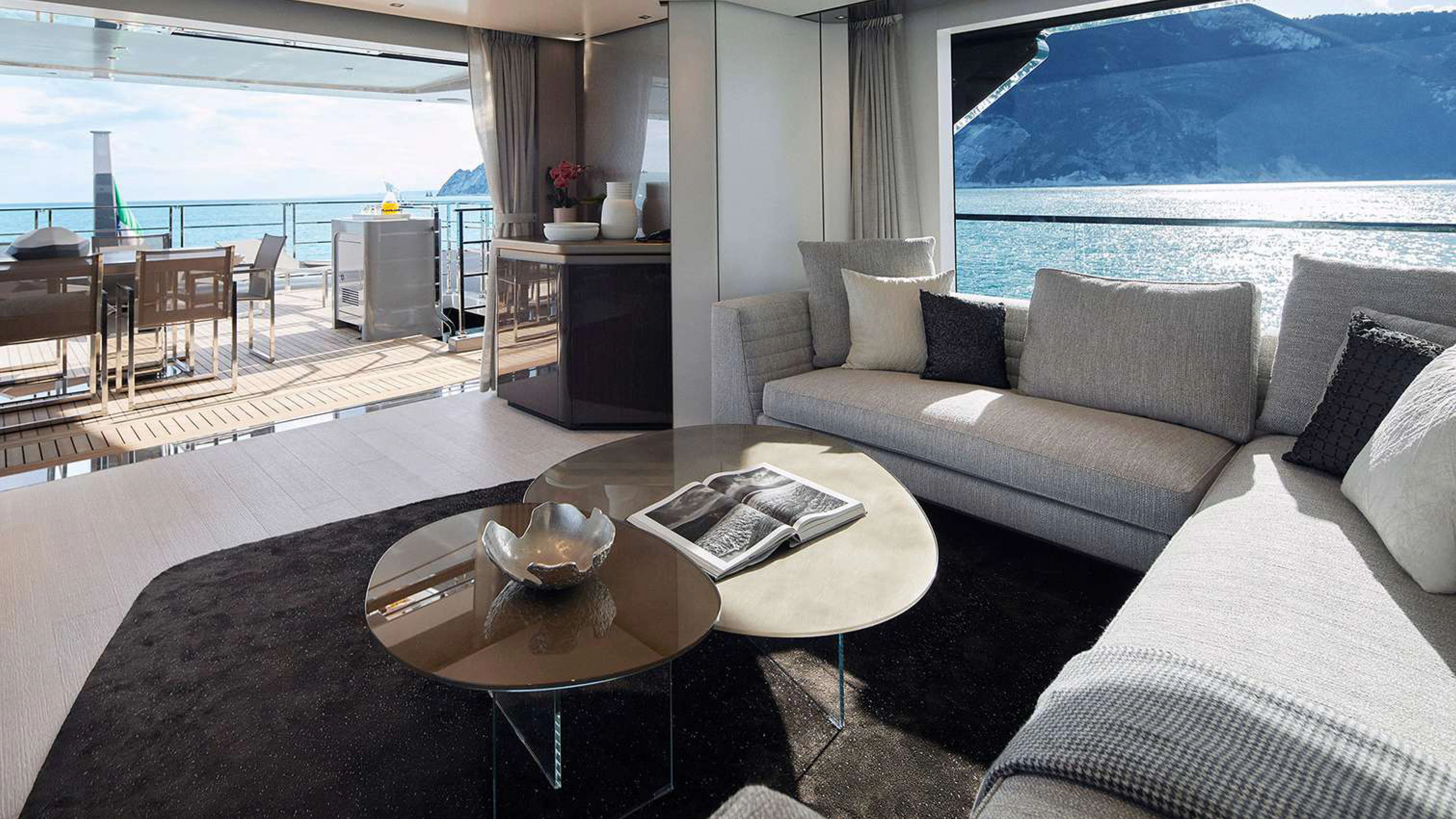 a living room with a large window aboard PAZIENZA Yacht for Charter