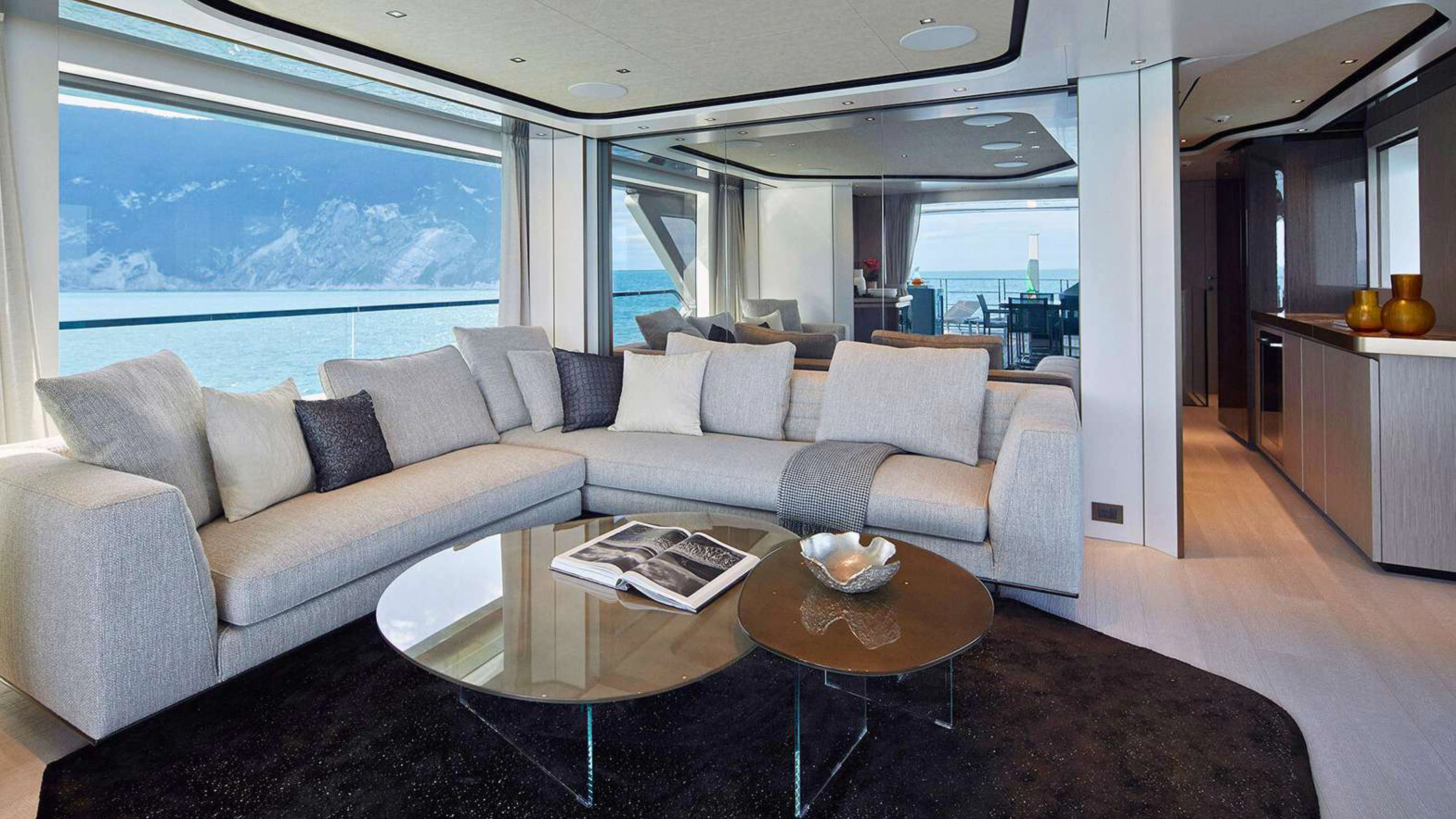 a living room with a couch and coffee table aboard PAZIENZA Yacht for Charter