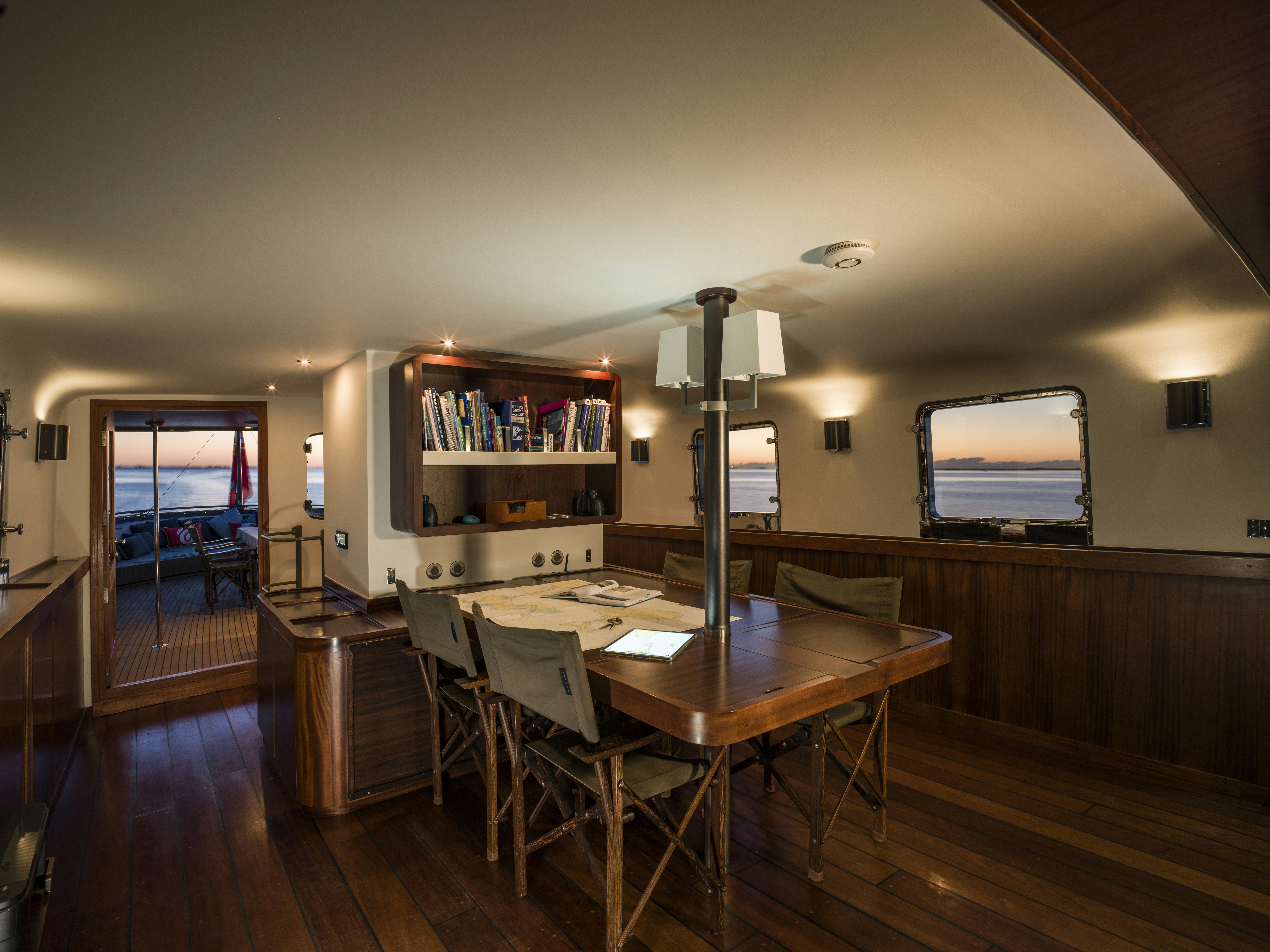 a room with a table and chairs aboard LA FENICE Yacht for Sale