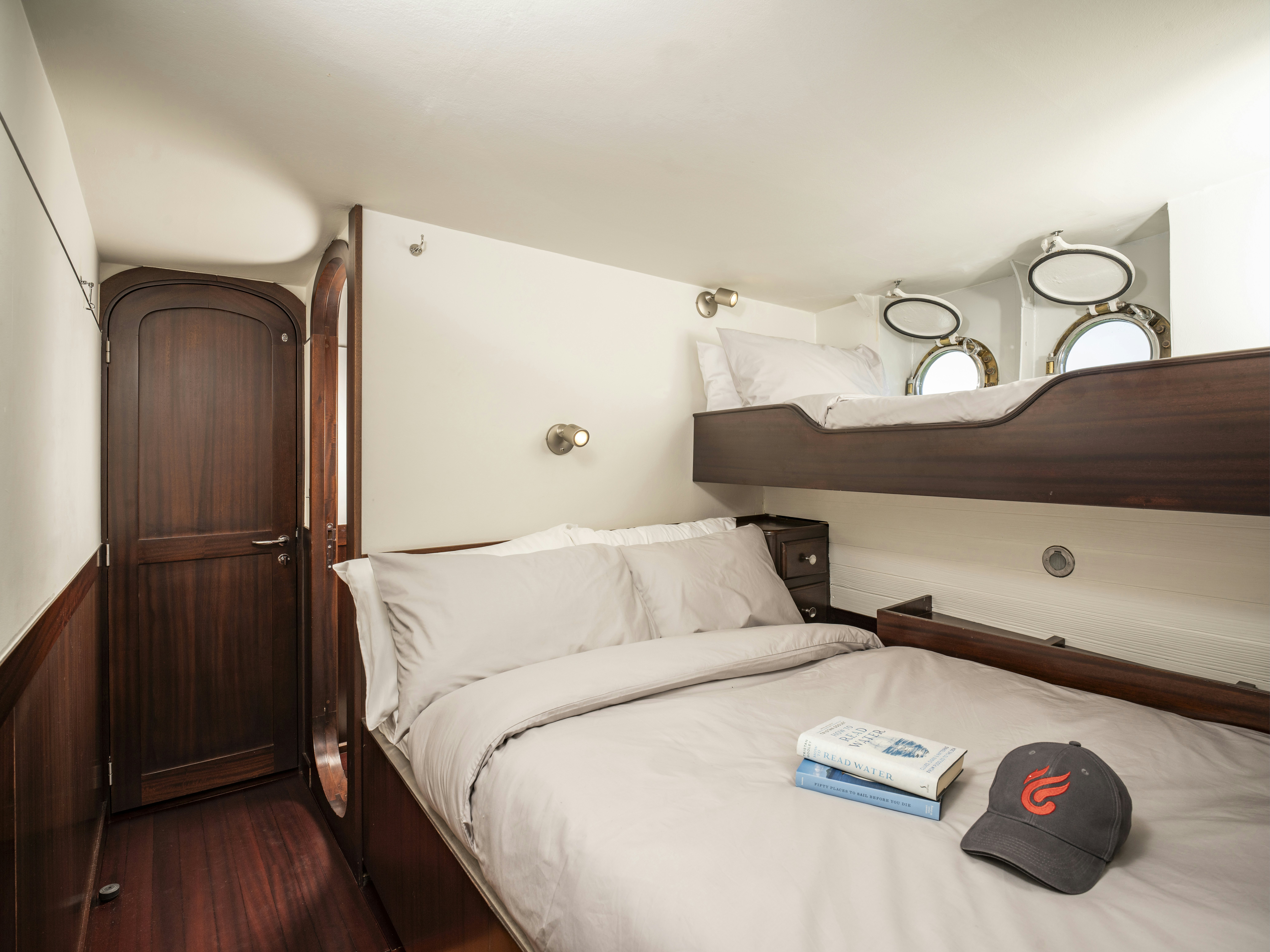 a bed with a hat on it aboard LA FENICE Yacht for Sale