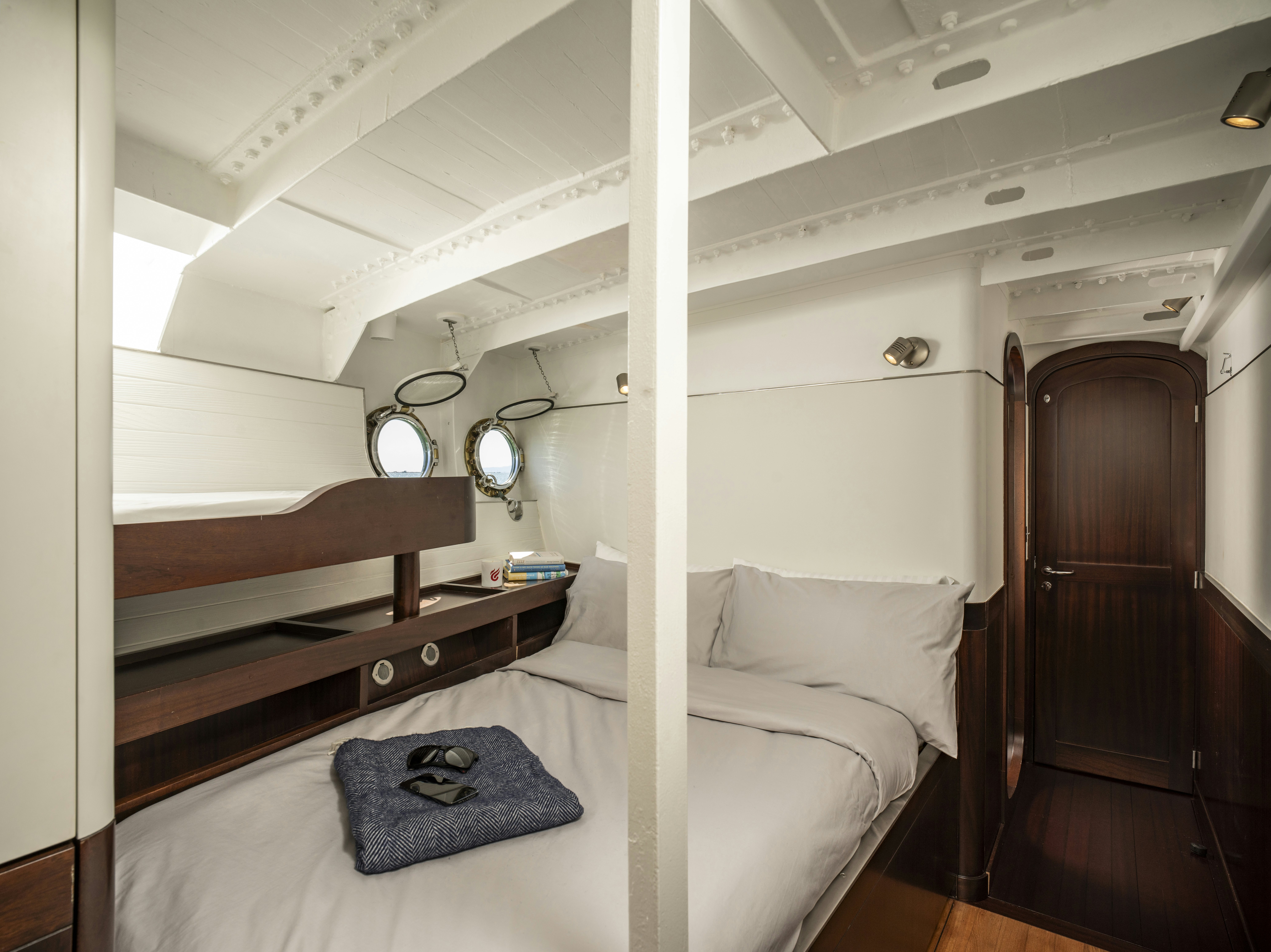a bed in a room aboard LA FENICE Yacht for Sale