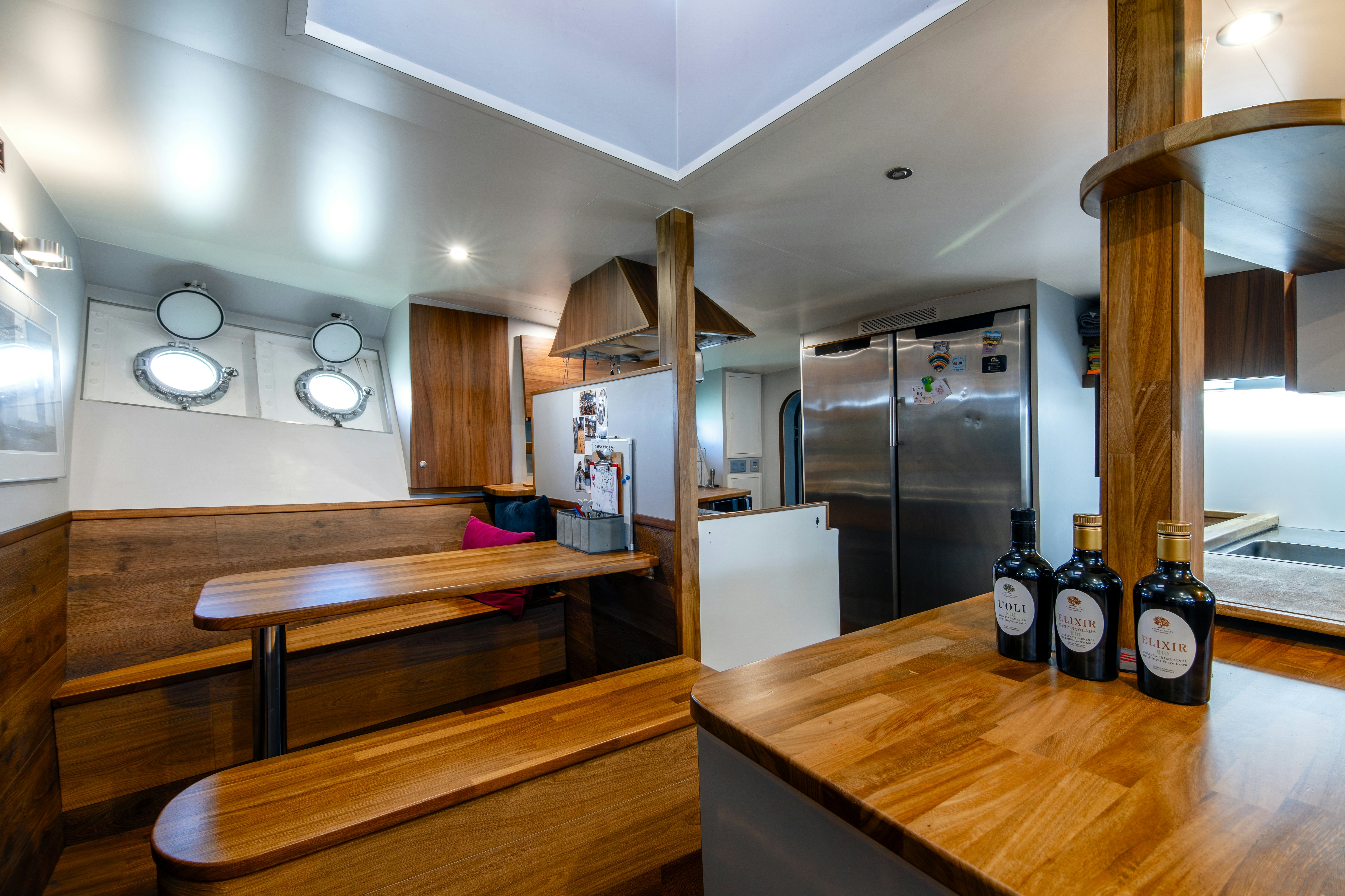 a room with a table and bottles aboard LA FENICE Yacht for Sale