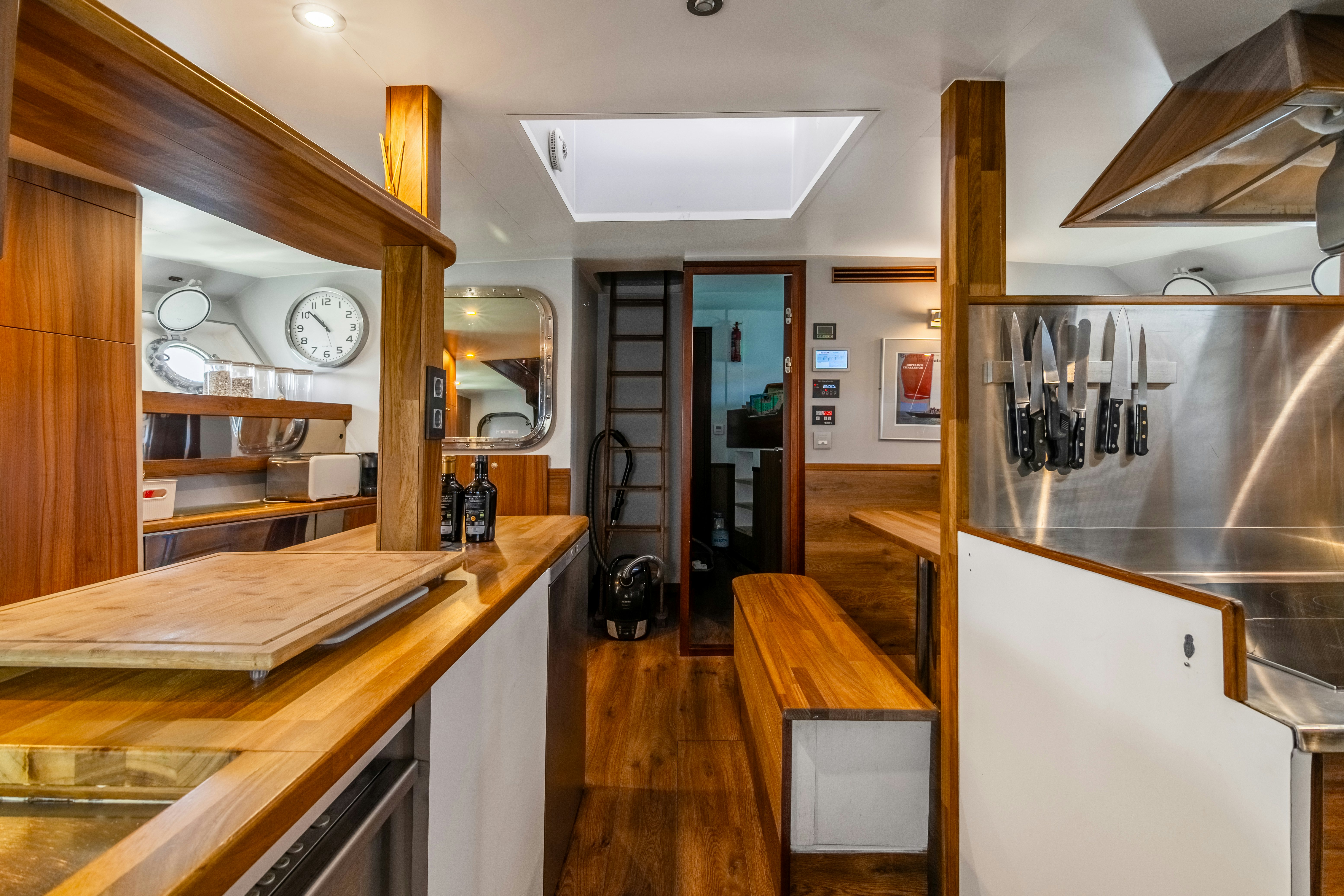 a kitchen with a bar and a bar aboard LA FENICE Yacht for Sale